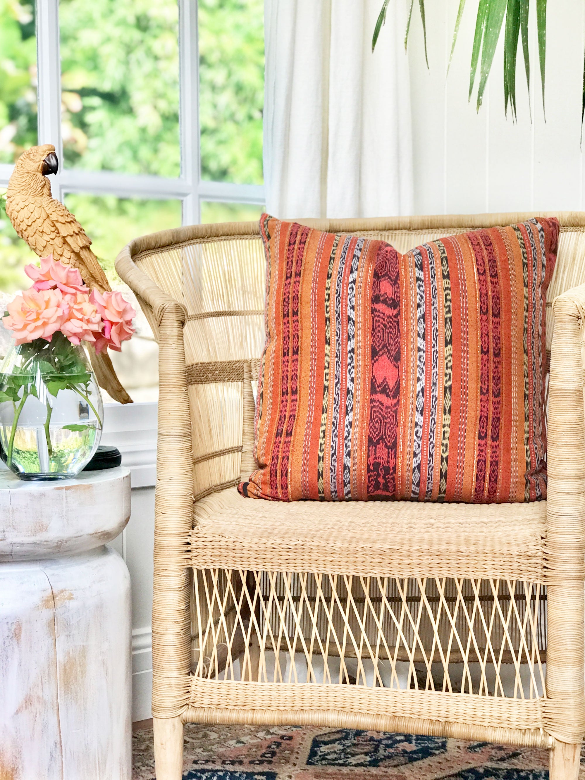 Vintage textile cushion made from a Guatemalan huipil and corte