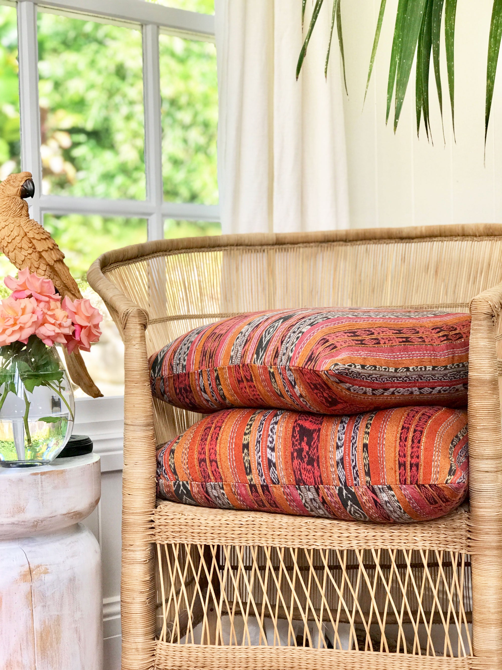 Vintage textile cushion made from a Guatemalan huipil and corte