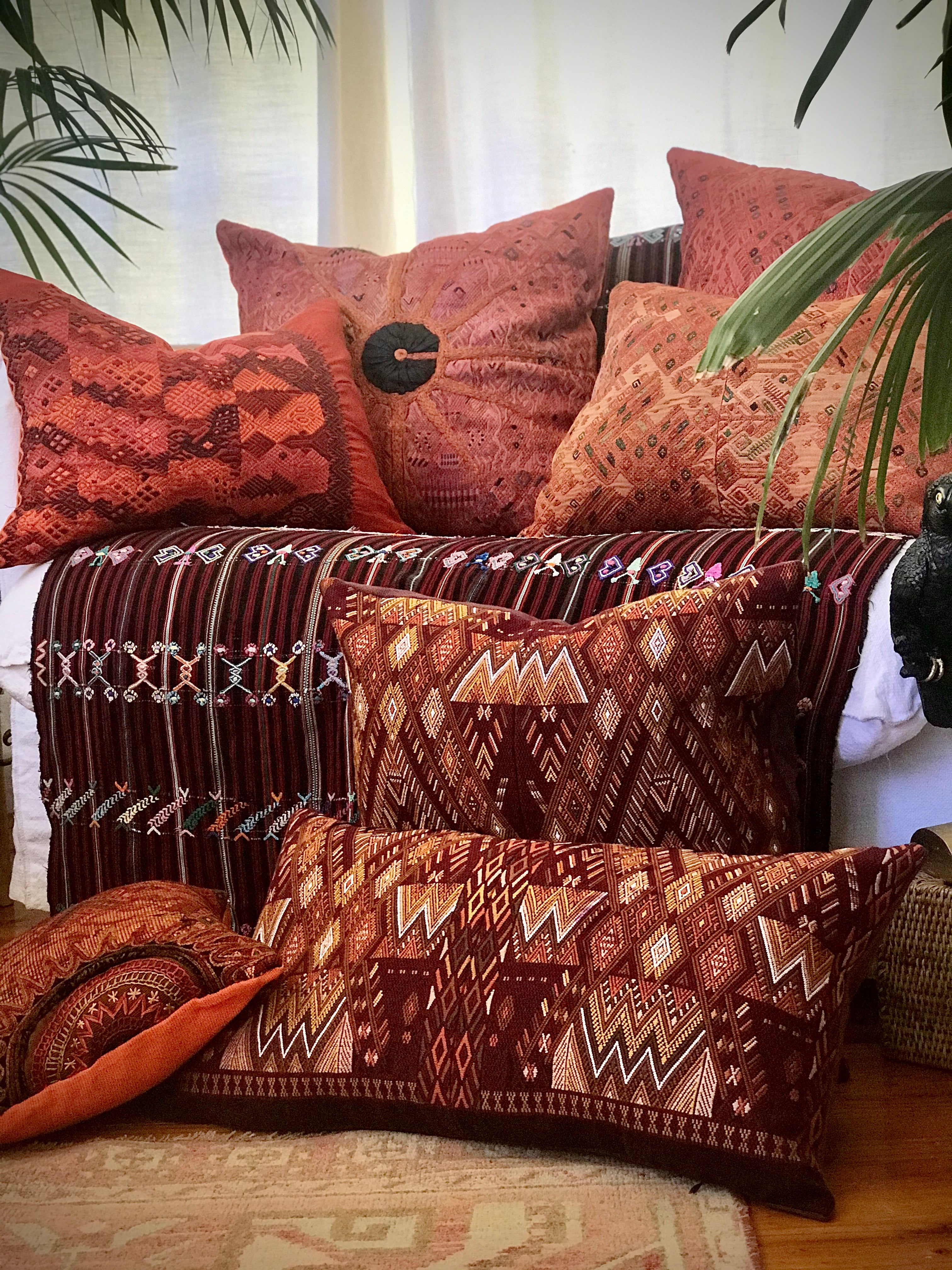 Guatemalan Huipil Textile Pillow, vintage, hand embroidered warm red Coban huipil with stylised peacocks and deer