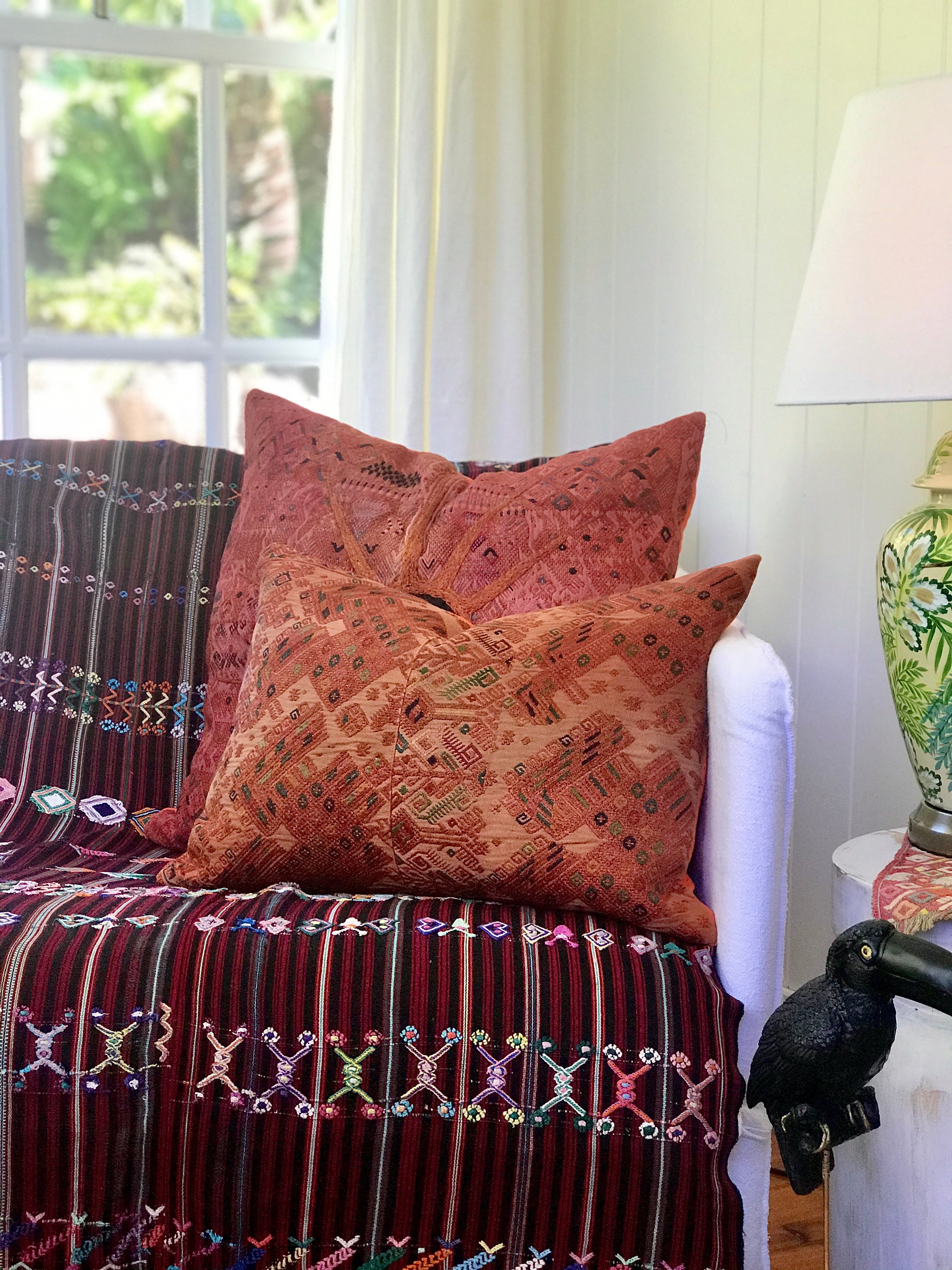 Guatemalan Huipil Textile Pillow, vintage, hand embroidered orange Nahuala huipil with a black sun in the centre