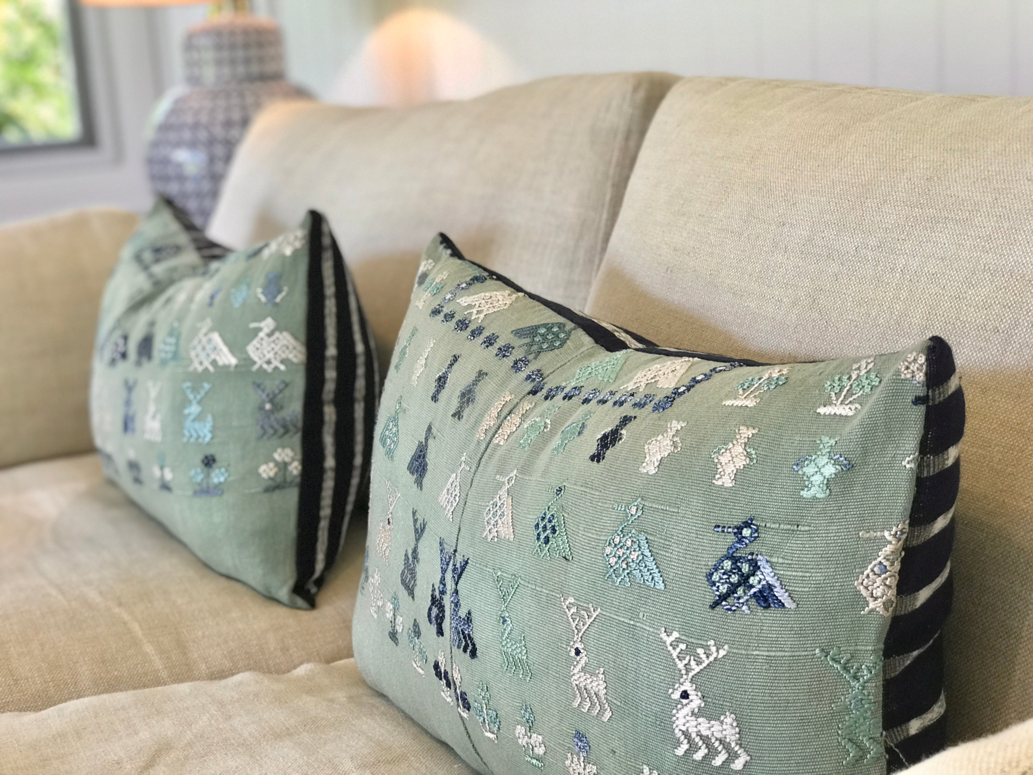 Vintage textile cushion made from a Guatemalan huipil and corte