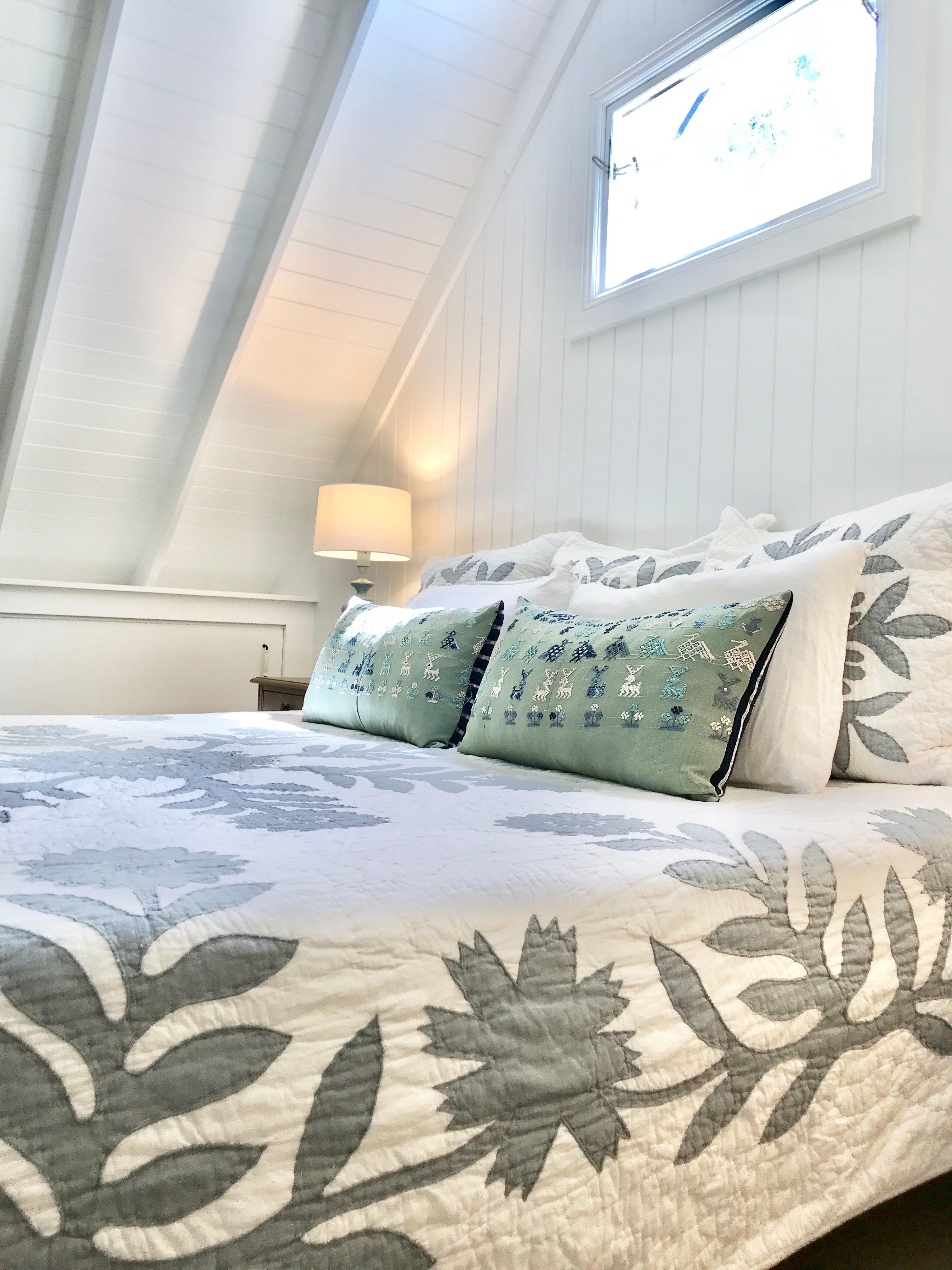 Vintage textile cushion made from a Guatemalan huipil and corte