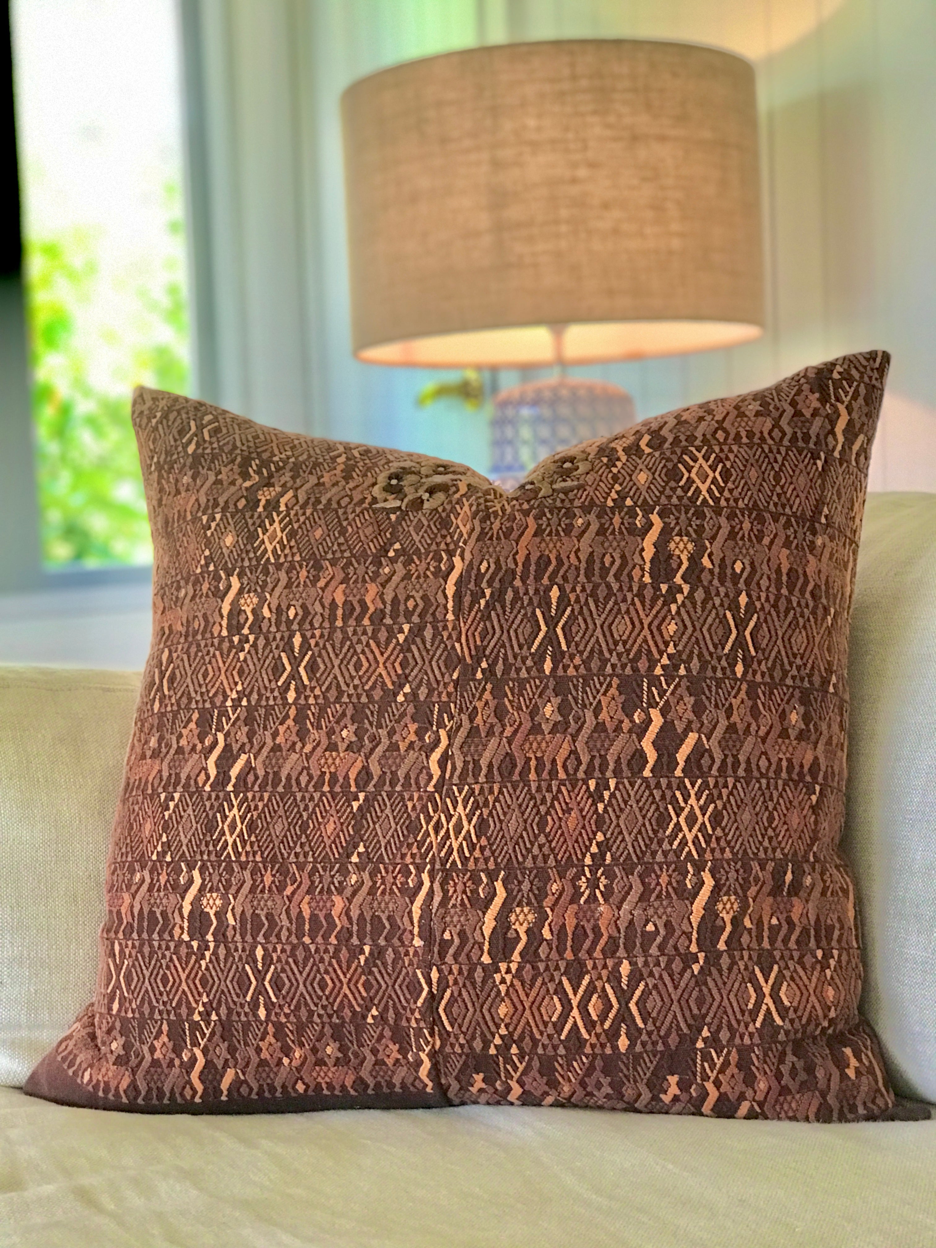 Vintage textile cushion made from a Guatemalan huipil and corte
