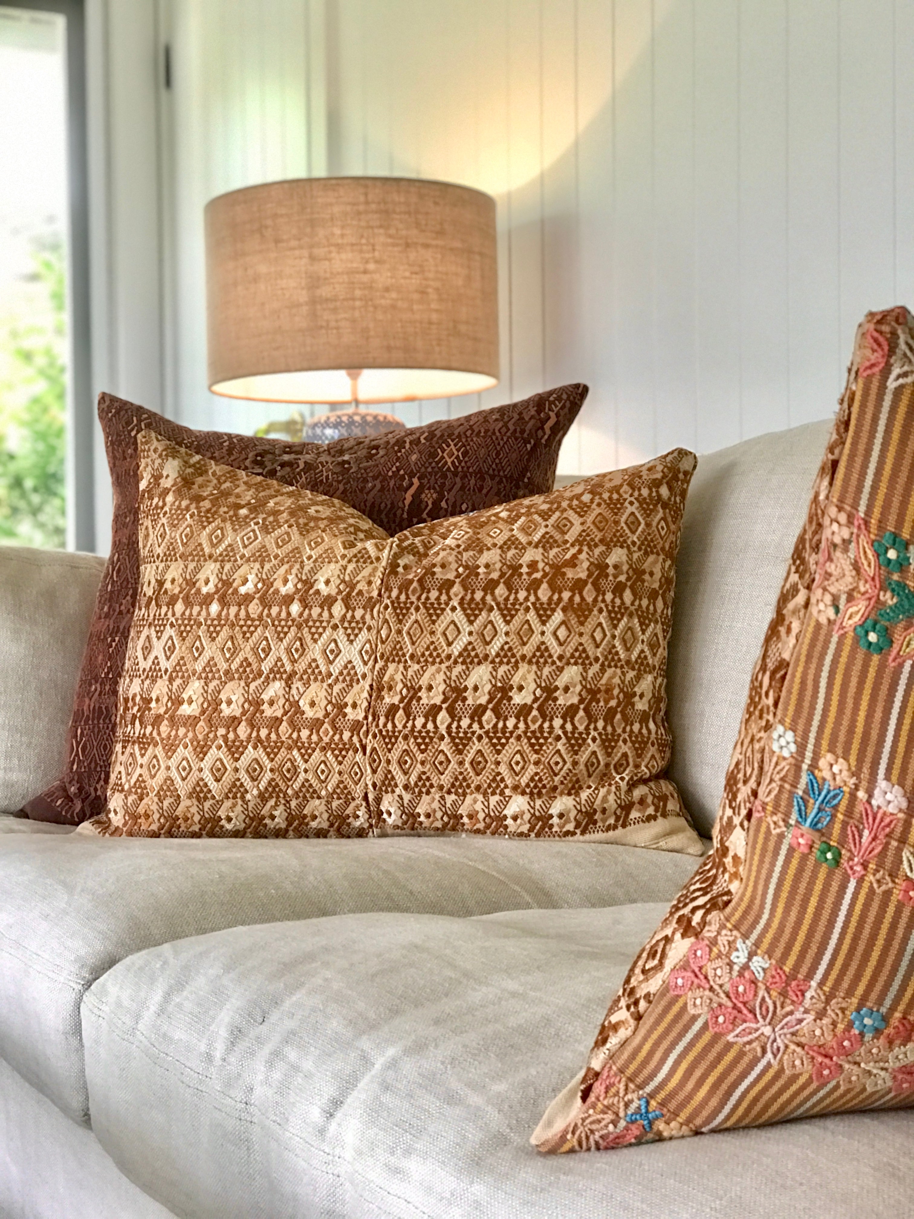 Vintage textile cushion made from a Guatemalan huipil and corte