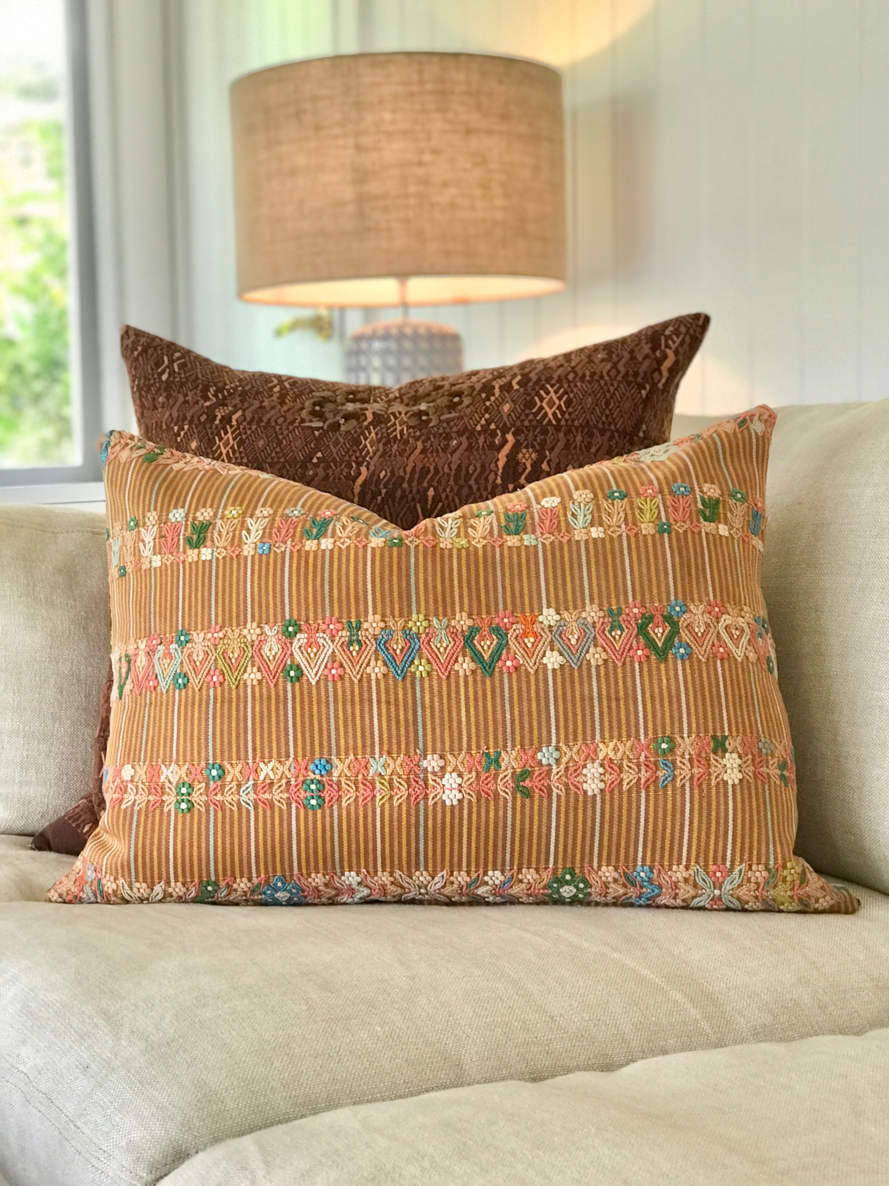 Vintage textile cushion made from a Guatemalan huipil and corte