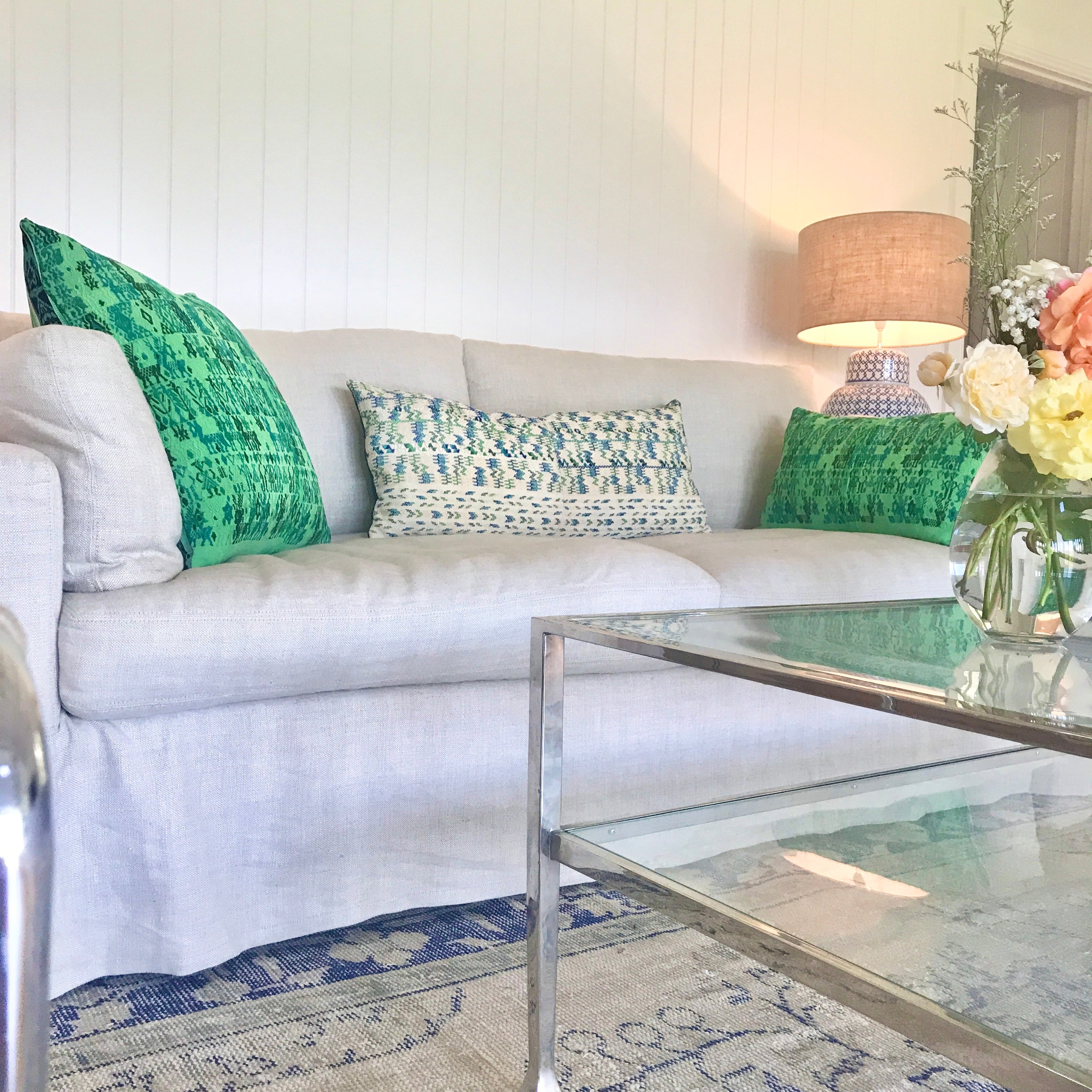 Vintage textile cushion made from a Guatemalan huipil and corte