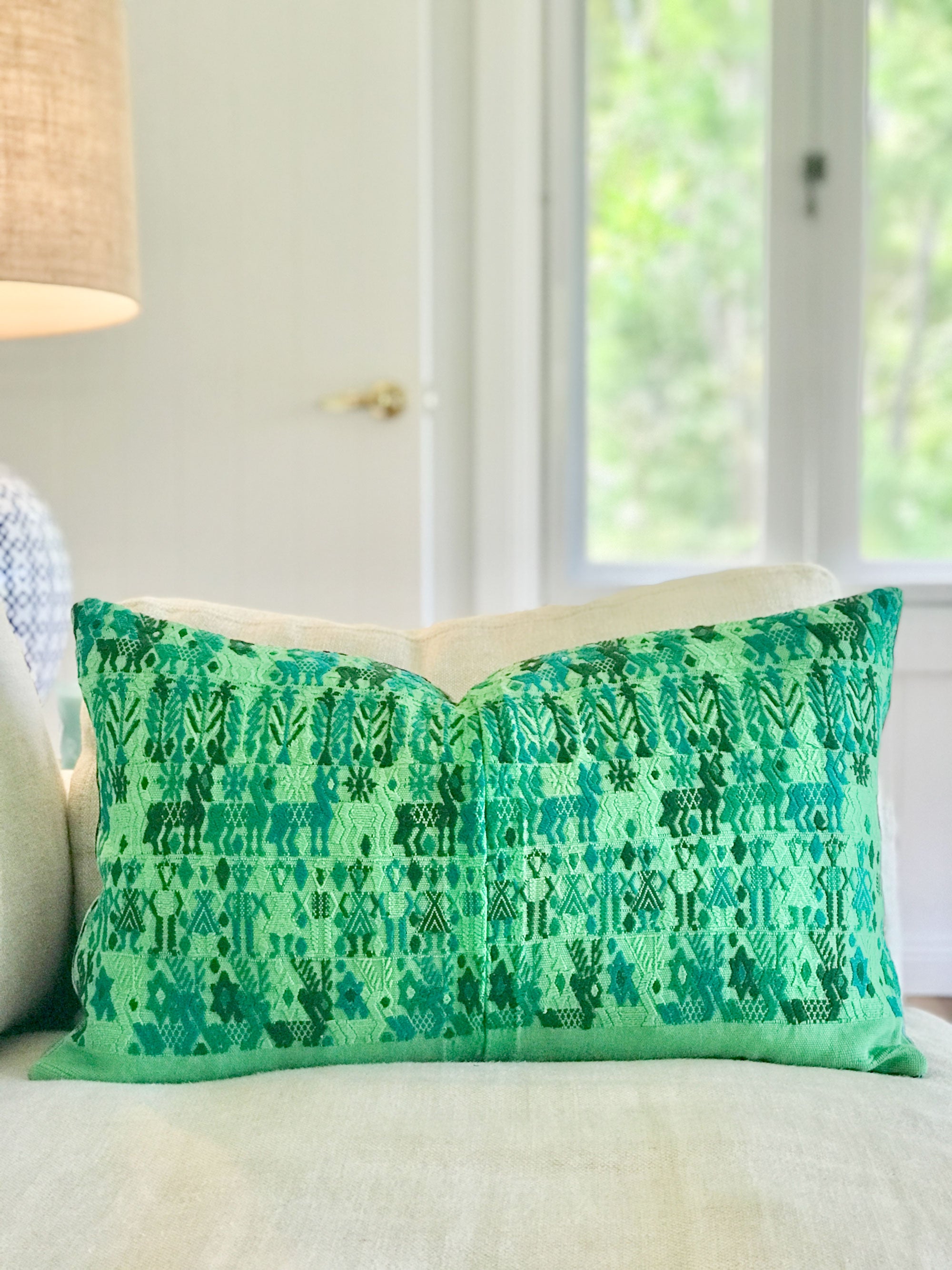 Vintage textile cushion made from a Guatemalan huipil and corte