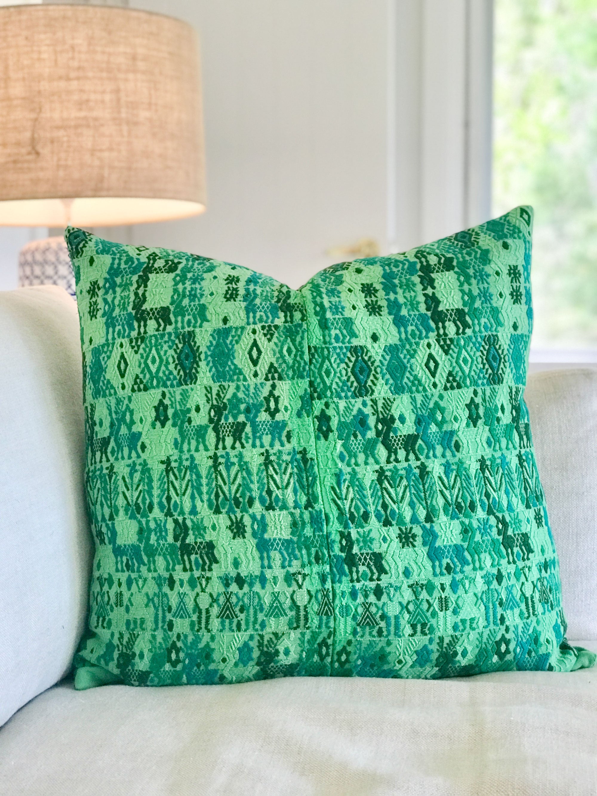 Vintage textile cushion made from a Guatemalan huipil and corte