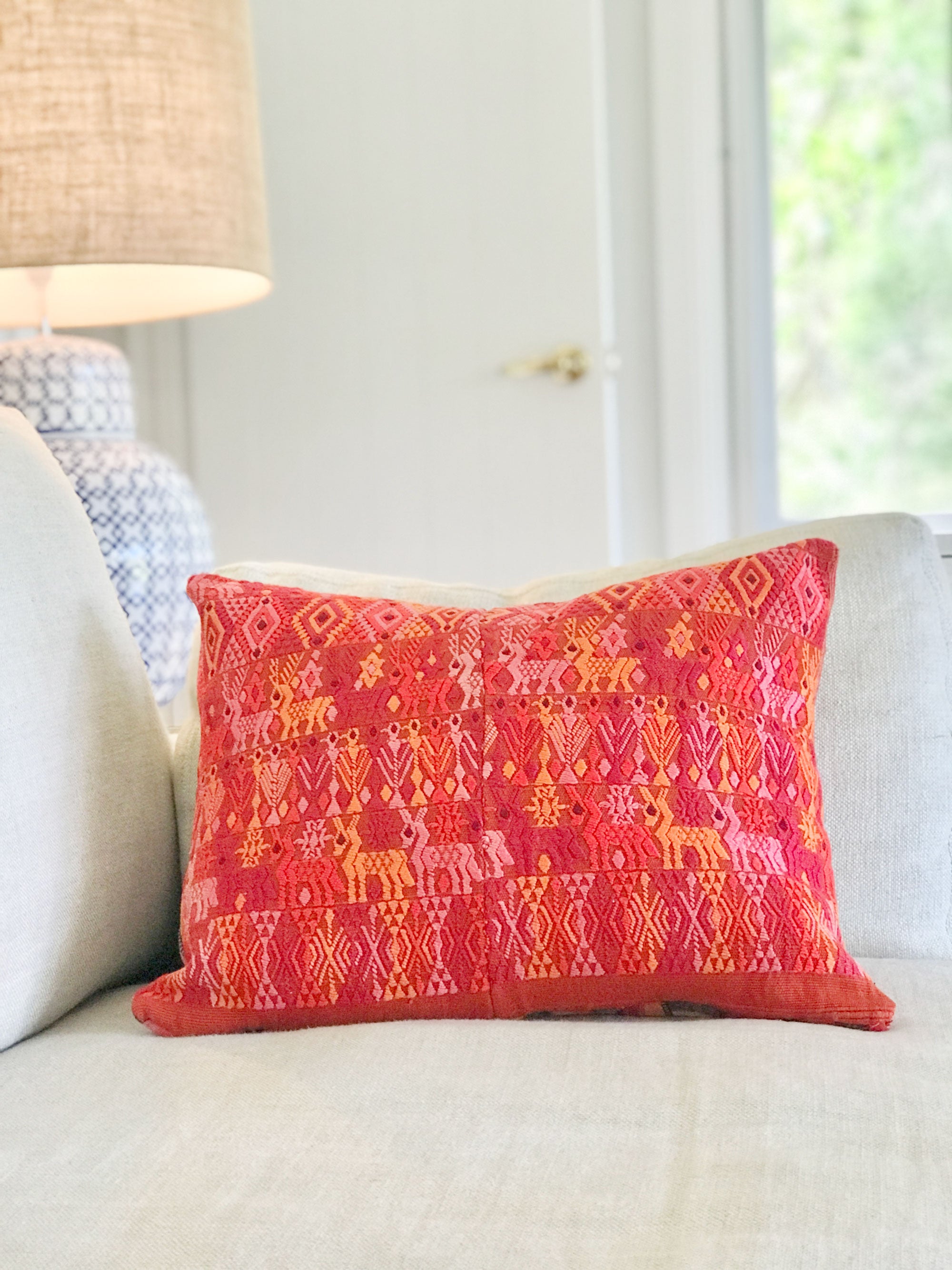Vintage textile cushion made from a Guatemalan huipil and corte