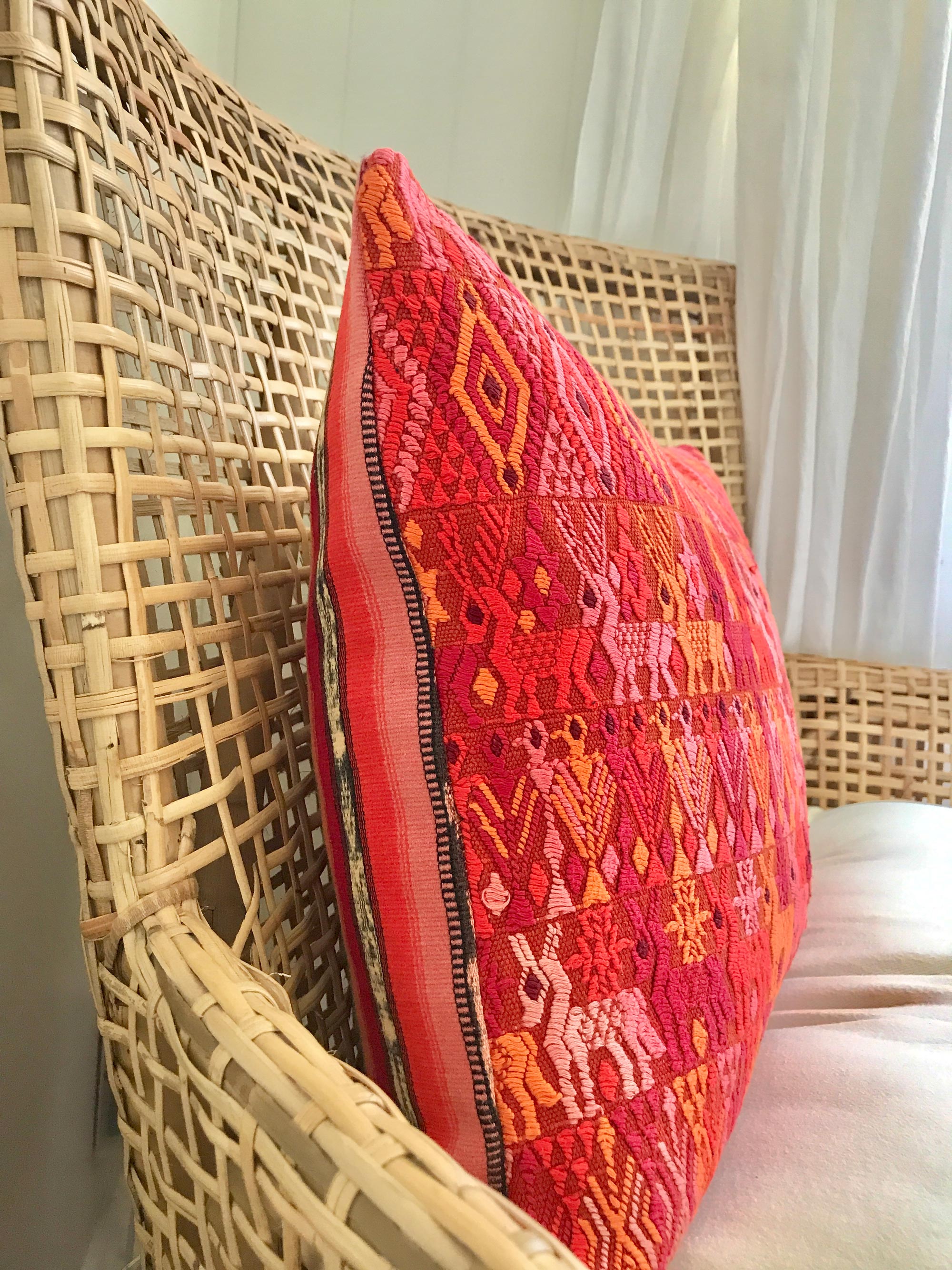 Vintage textile cushion made from a Guatemalan huipil and corte
