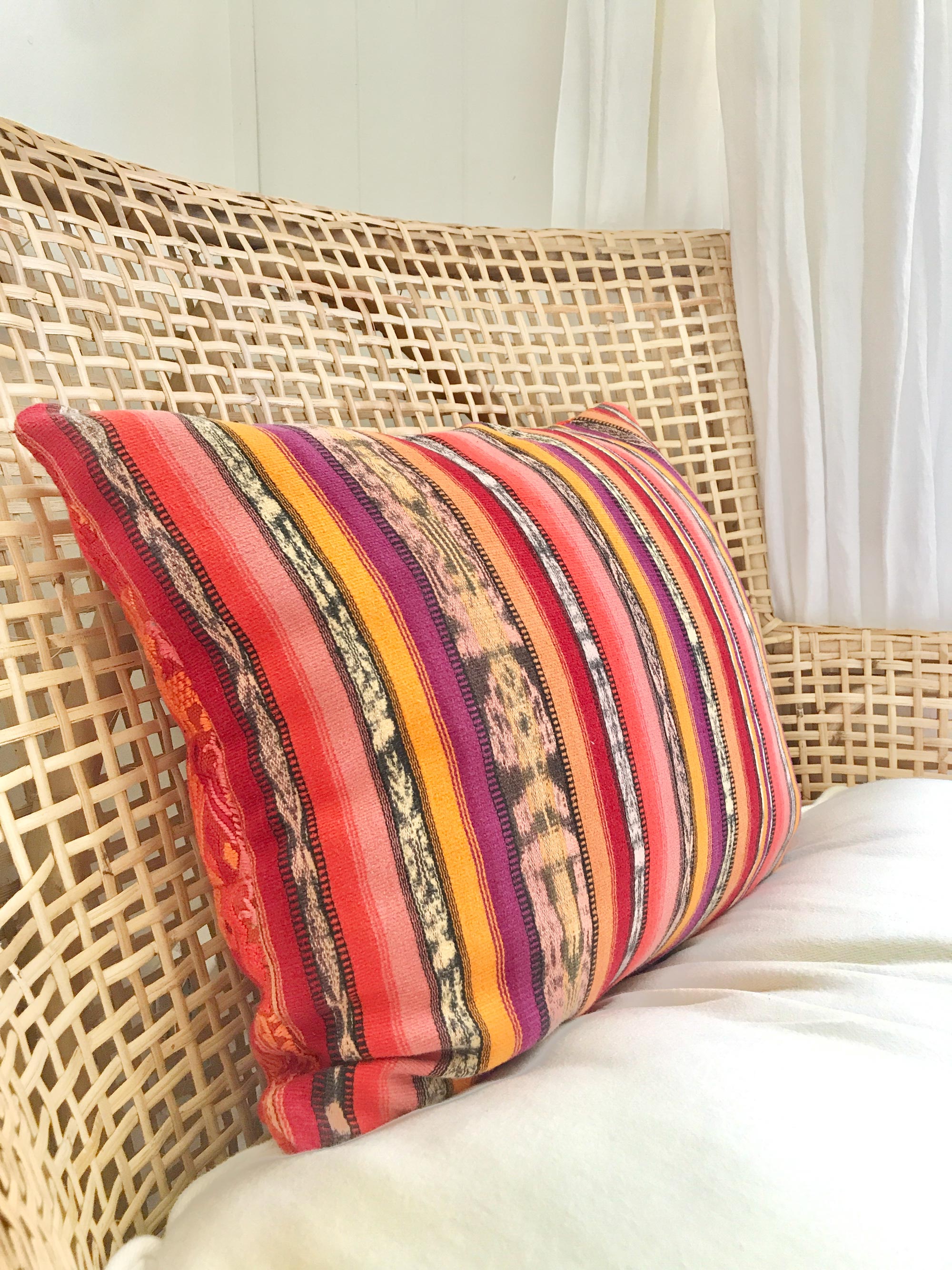 Vintage textile cushion made from a Guatemalan huipil and corte