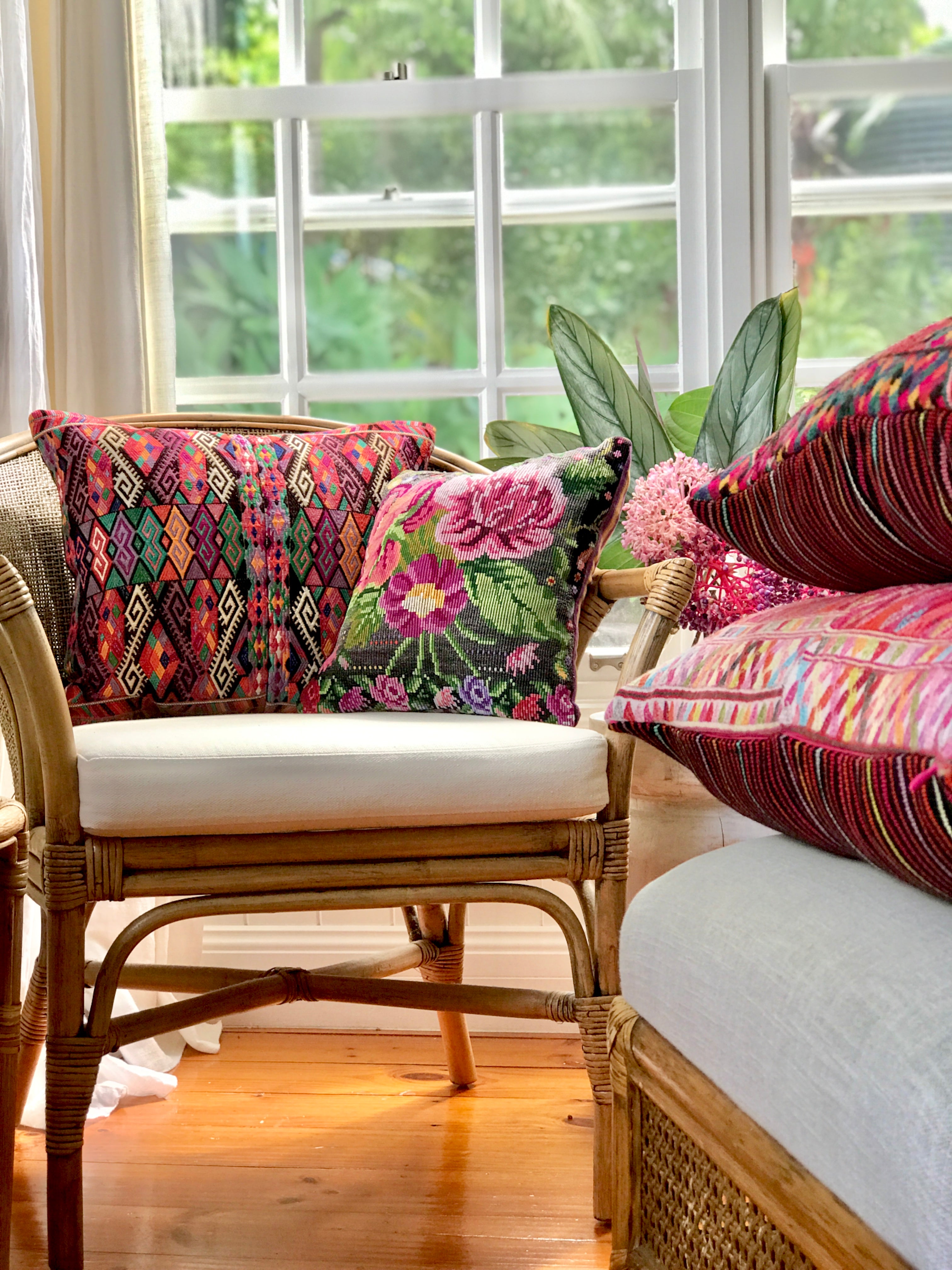 Vintage textile cushion made from a Guatemalan huipil and corte