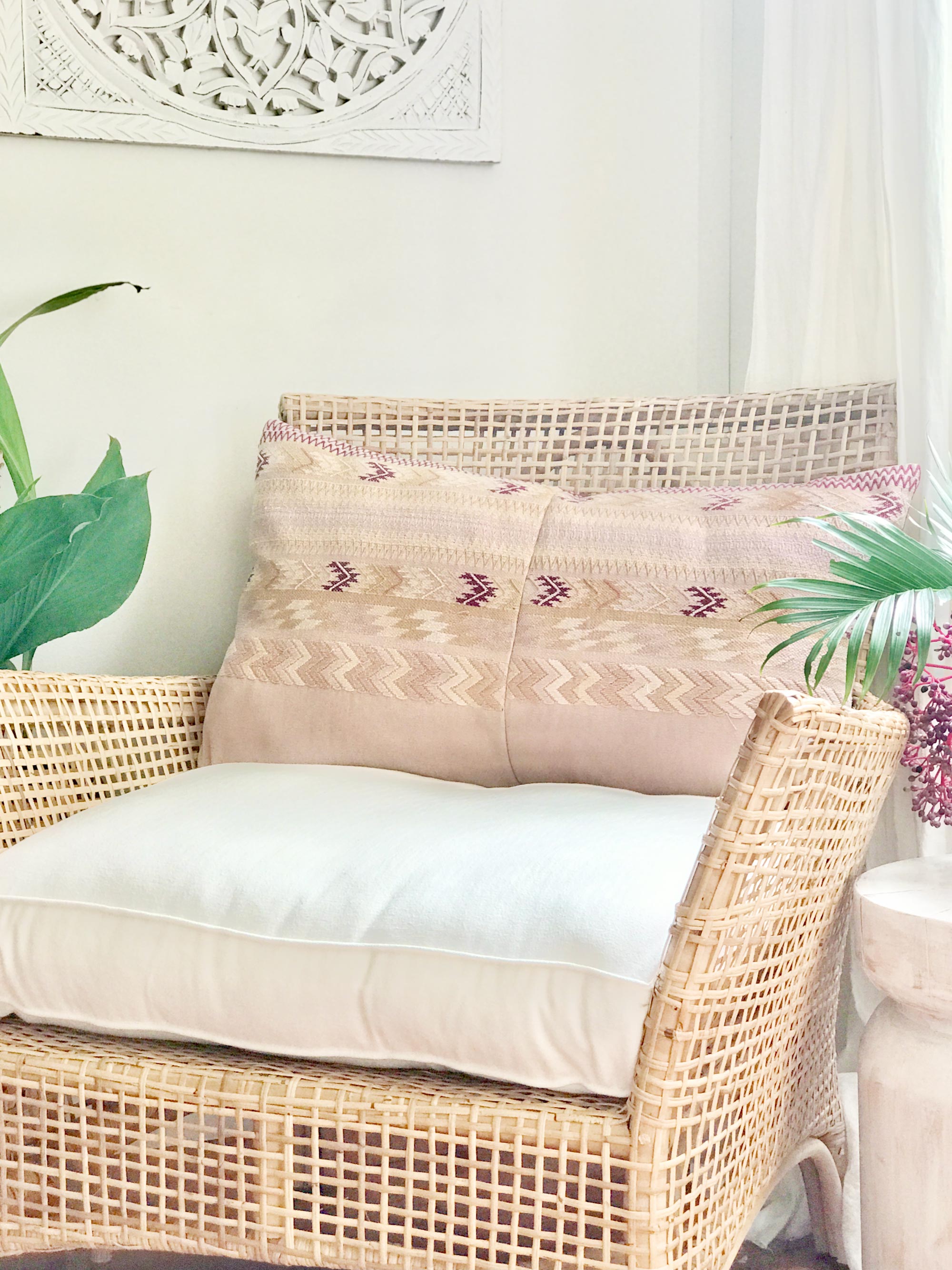 Vintage textile cushion made from a Guatemalan huipil and corte