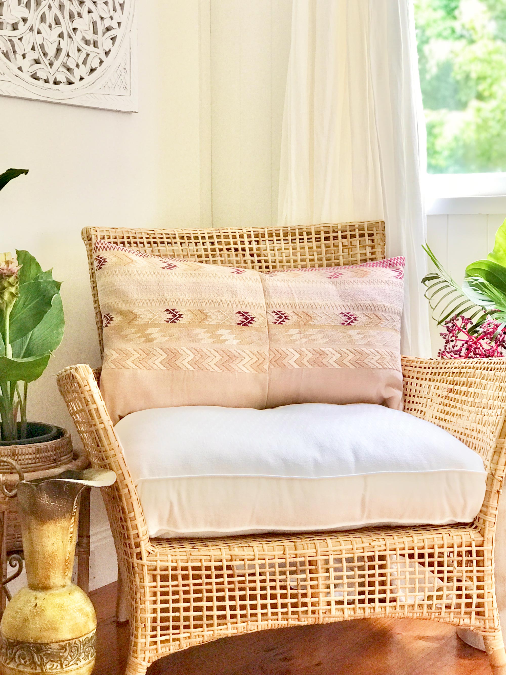 Vintage textile cushion made from a Guatemalan huipil and corte