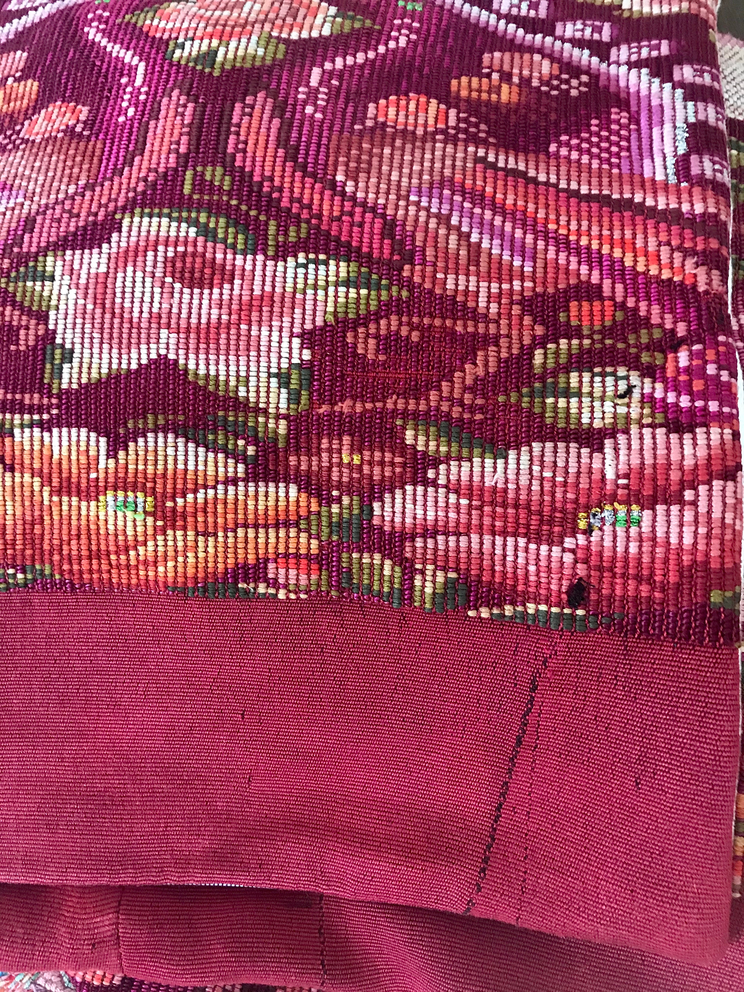 Guatemalan embroidered huipil pillow. Maximilist design of flowers and peacocks in rich burgundy.