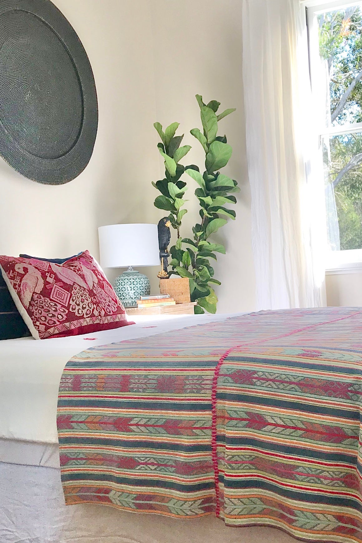 Guatemalan huipil pillow. A vintage textile with a red peacock bird design.