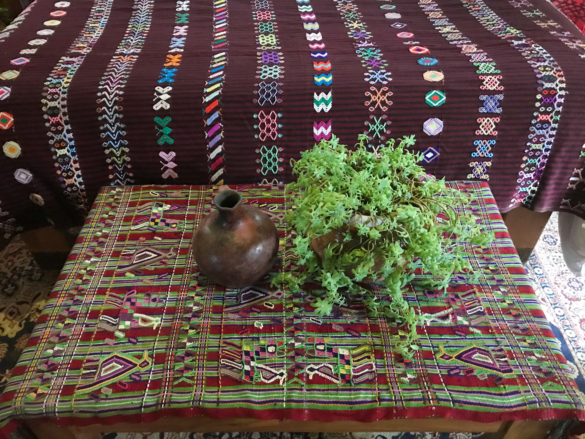Guatemalan Textile, red and green hand embroidered table runner with fringe, originally a Nebaj tzute