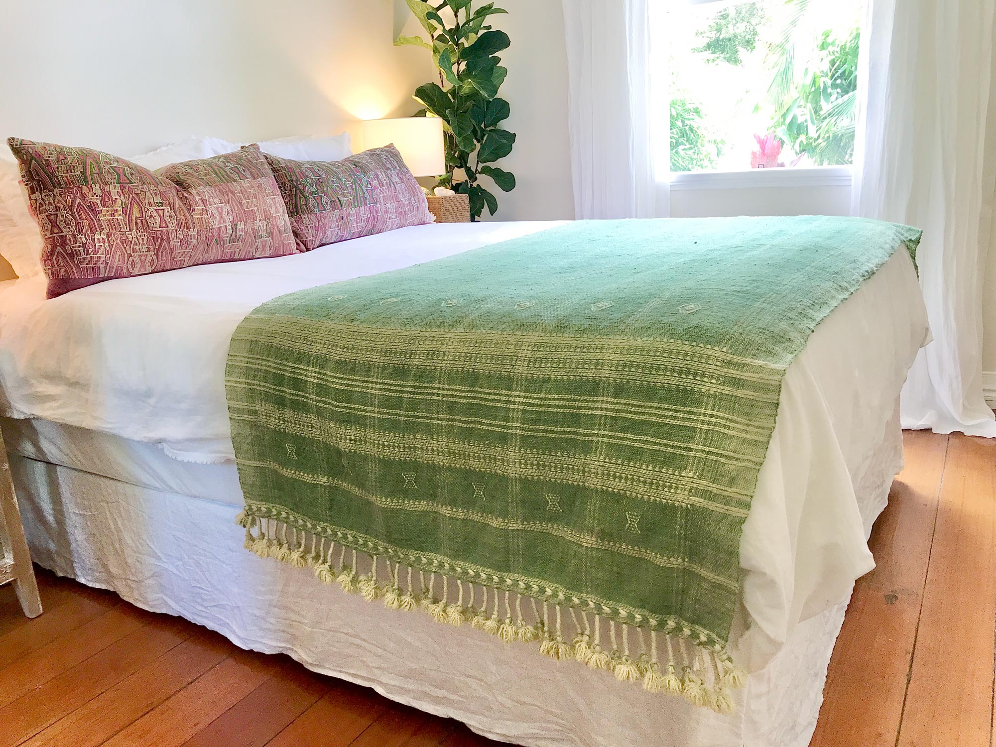 Vintage textile cushions made from a Guatemalan huipil and corte.