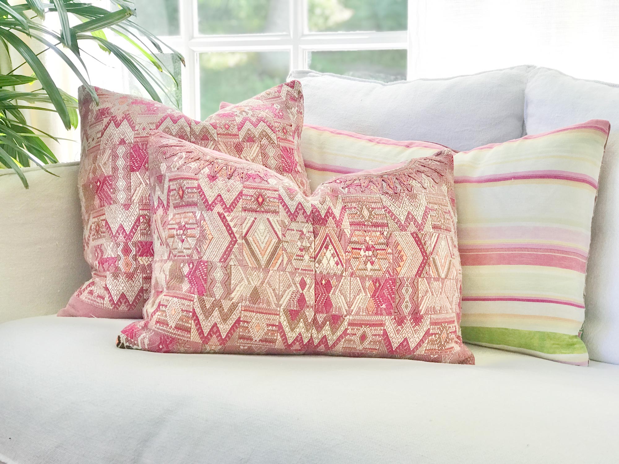 Vintage textile cushions made from a Guatemalan huipil and corte.