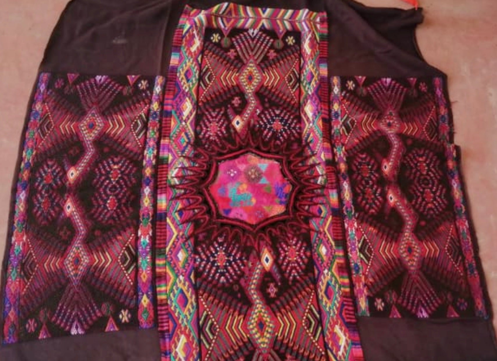 Guatemalan huipil pillow. A darkly exotic vintage textile with a stylised rising phoenix bird design.