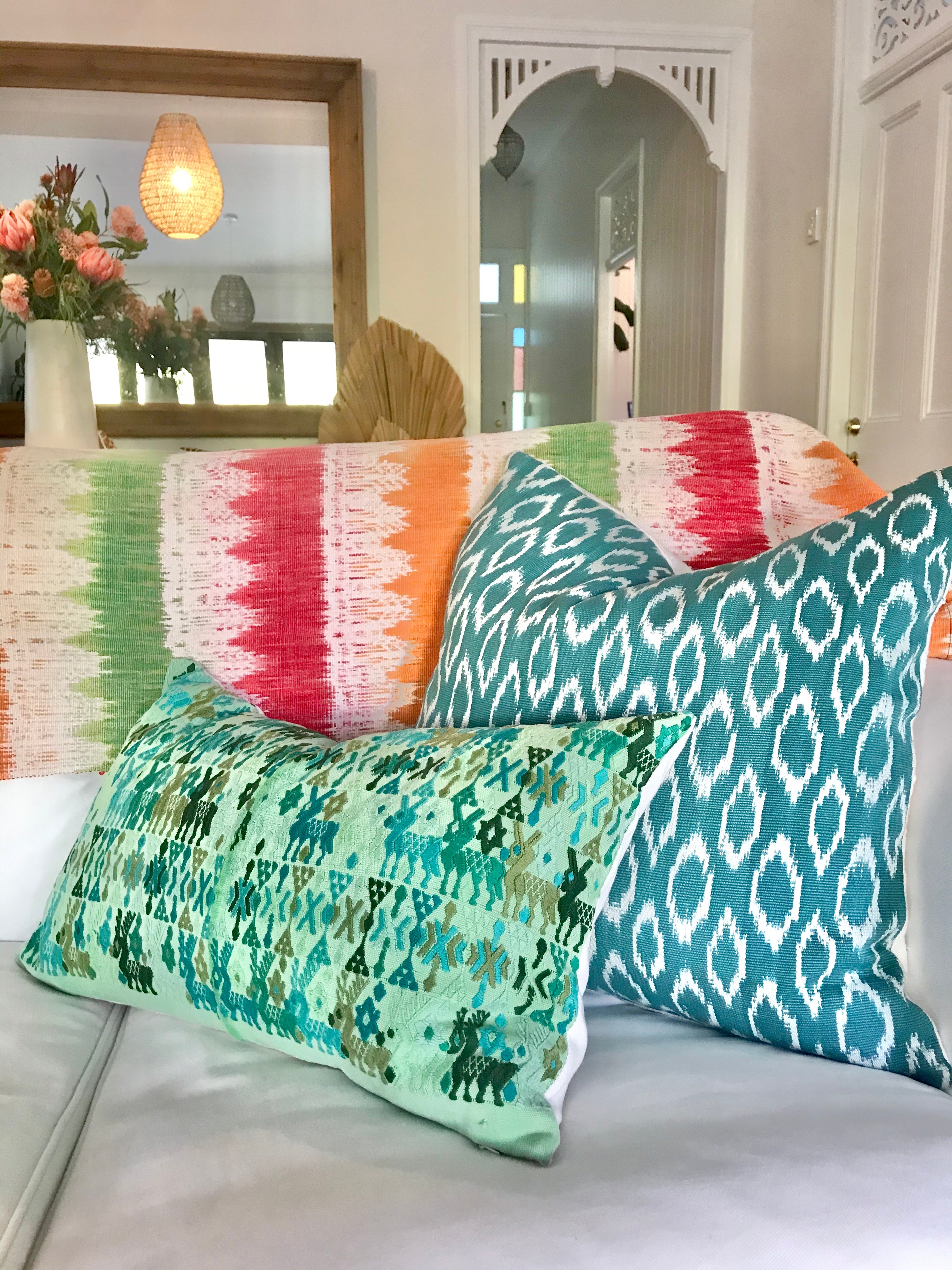 Guatemalan embroidered huipil pillow. Tribal symbols for bohemian decor.