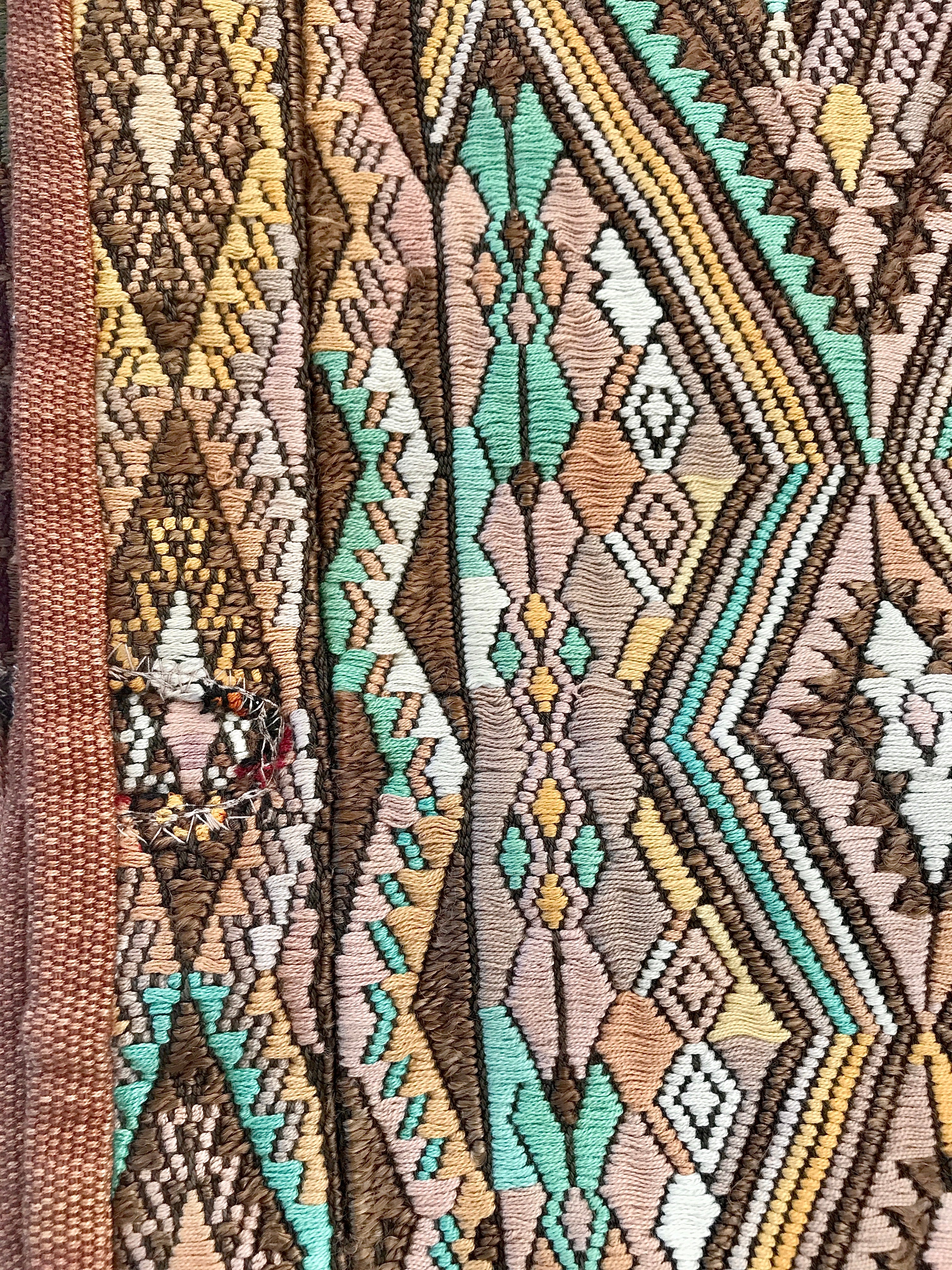 Embroidered Guatemalan huipil textile repurposed into a pillow