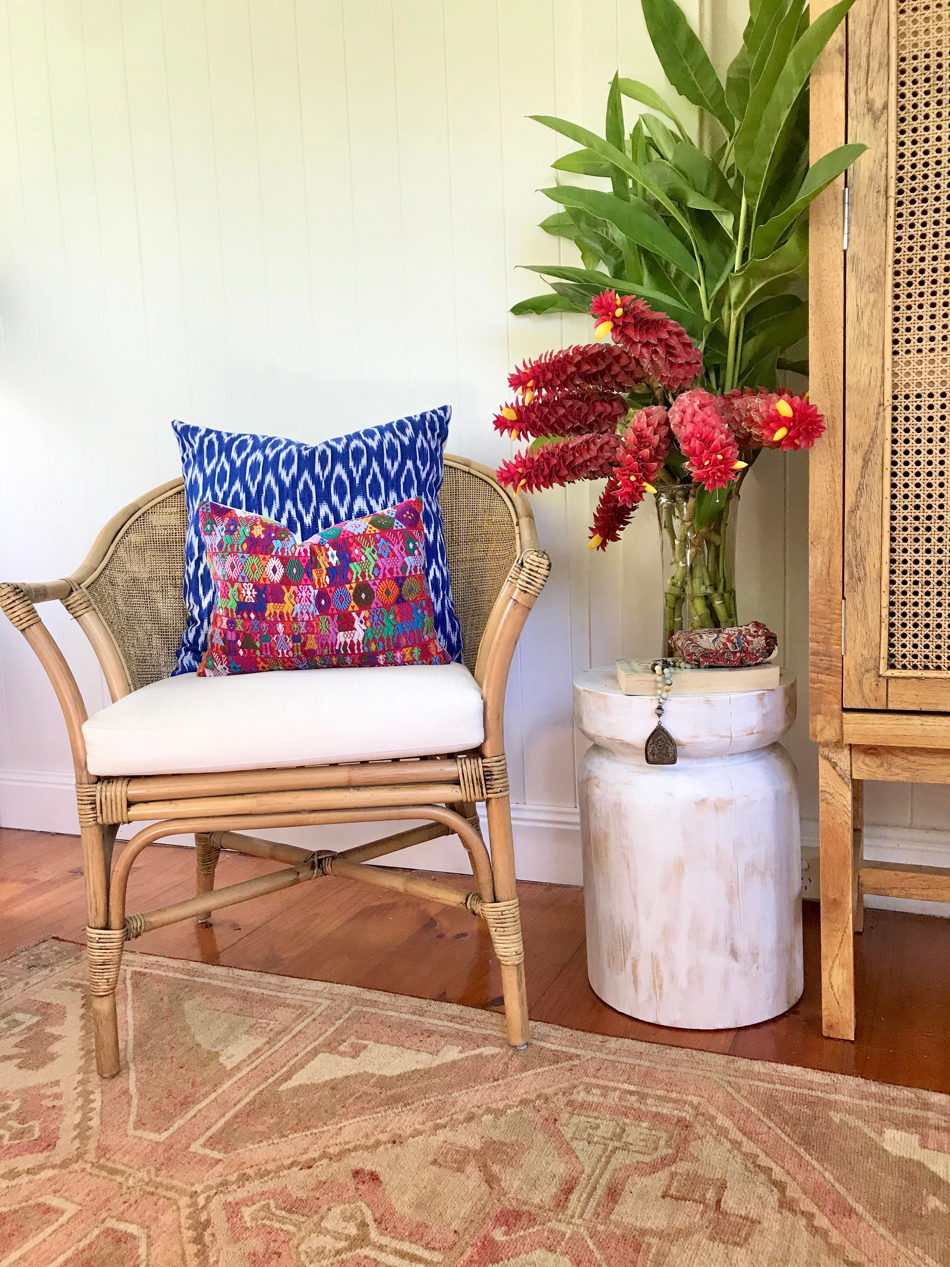 Guatemalan Huipil Pillow, vintage, hand embroidered Coban textile of brightly coloured tribal figures over a red cotton