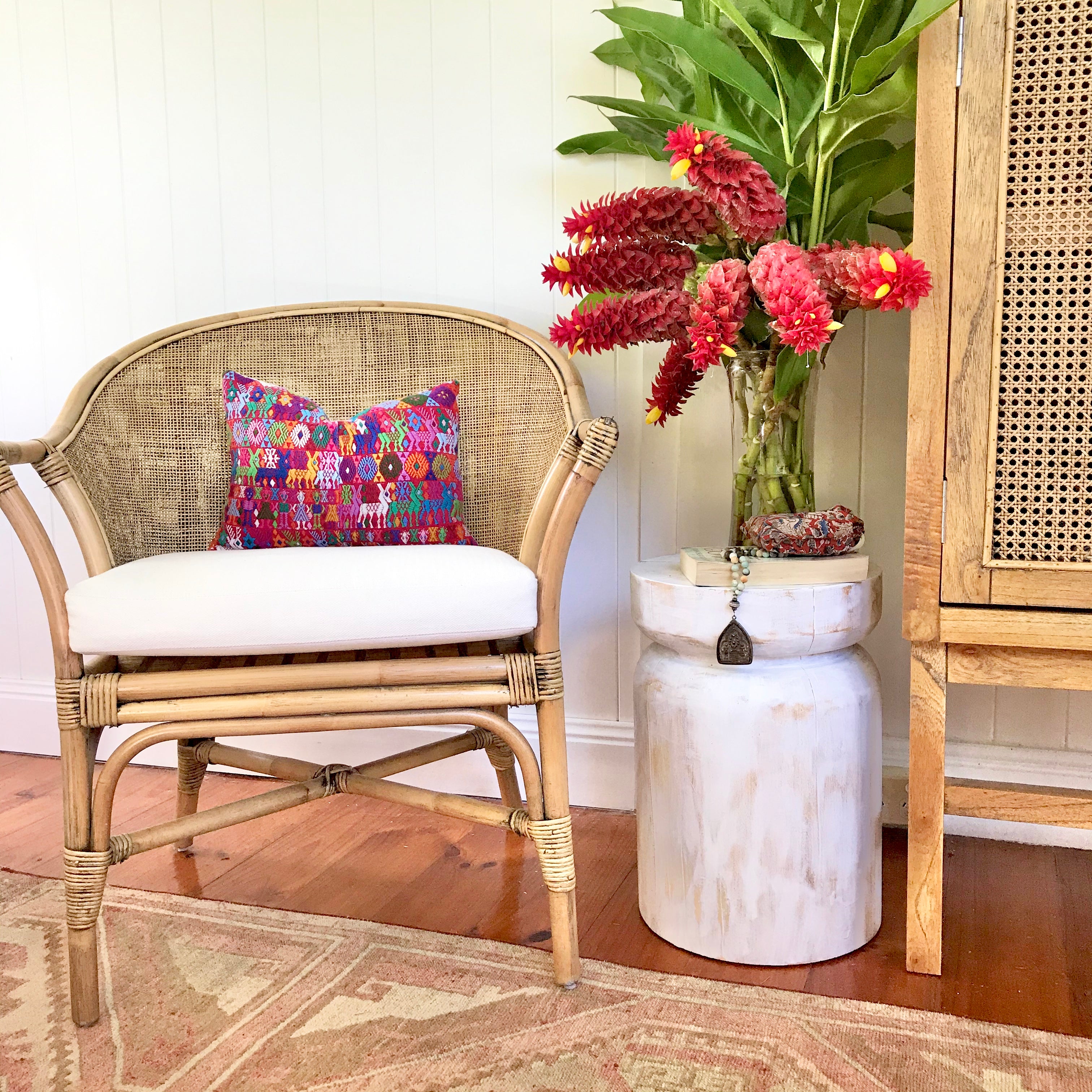 Guatemalan Huipil Pillow, vintage, hand embroidered Coban textile of brightly coloured tribal figures over a red cotton