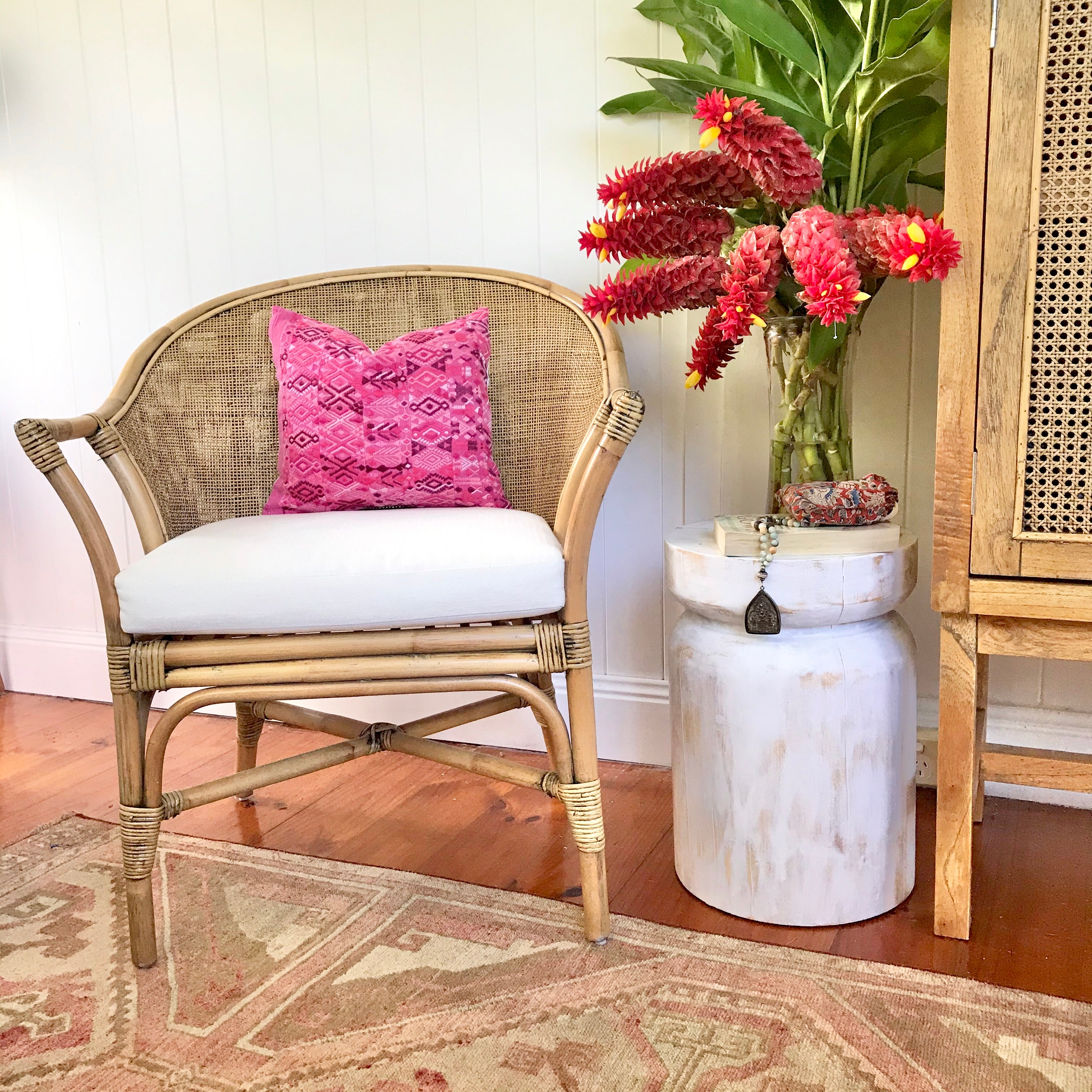 A pair of Guatemalan Huipil Pillows, vintage, hand embroidered textiles in bright pink with a playful tribal design