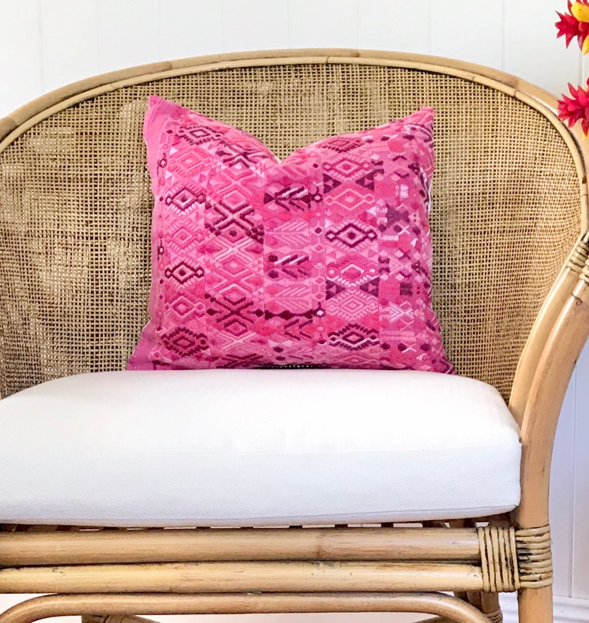 A pair of Guatemalan Huipil Pillows, vintage, hand embroidered textiles in bright pink with a playful tribal design