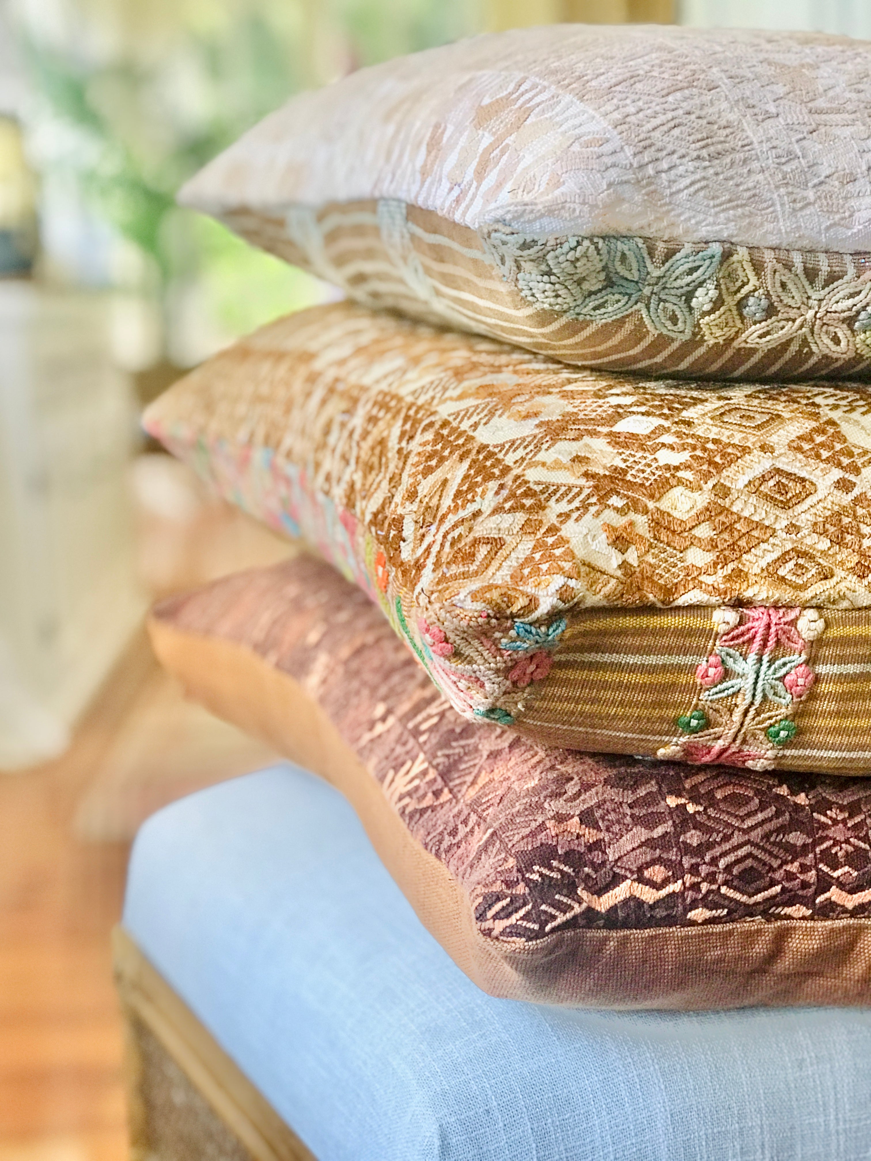 Vintage textile cushions made from a Guatemalan huipil and corte.