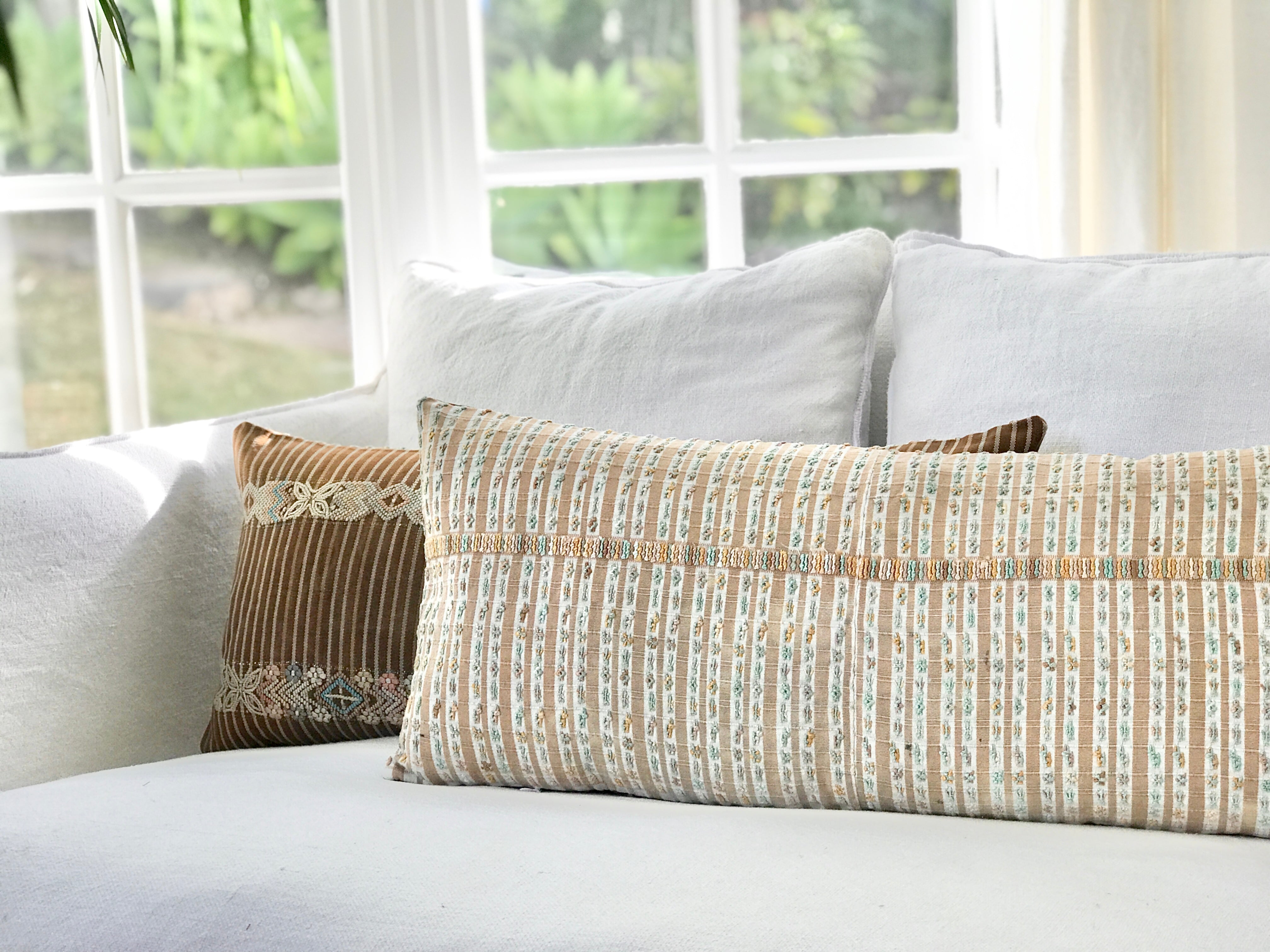 Vintage textile pillows made from a Guatemalan huipil and corte.