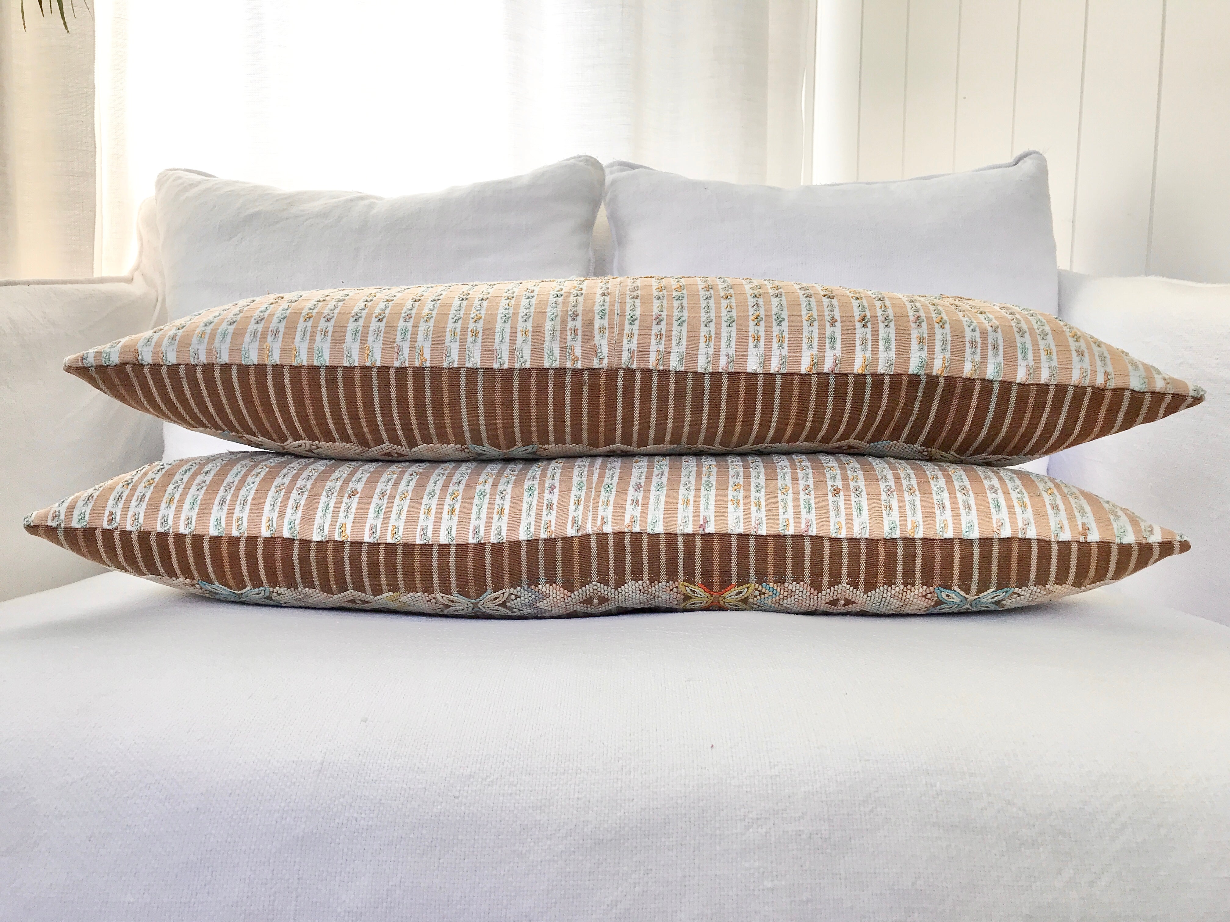 Vintage textile pillows made from a Guatemalan huipil and corte.
