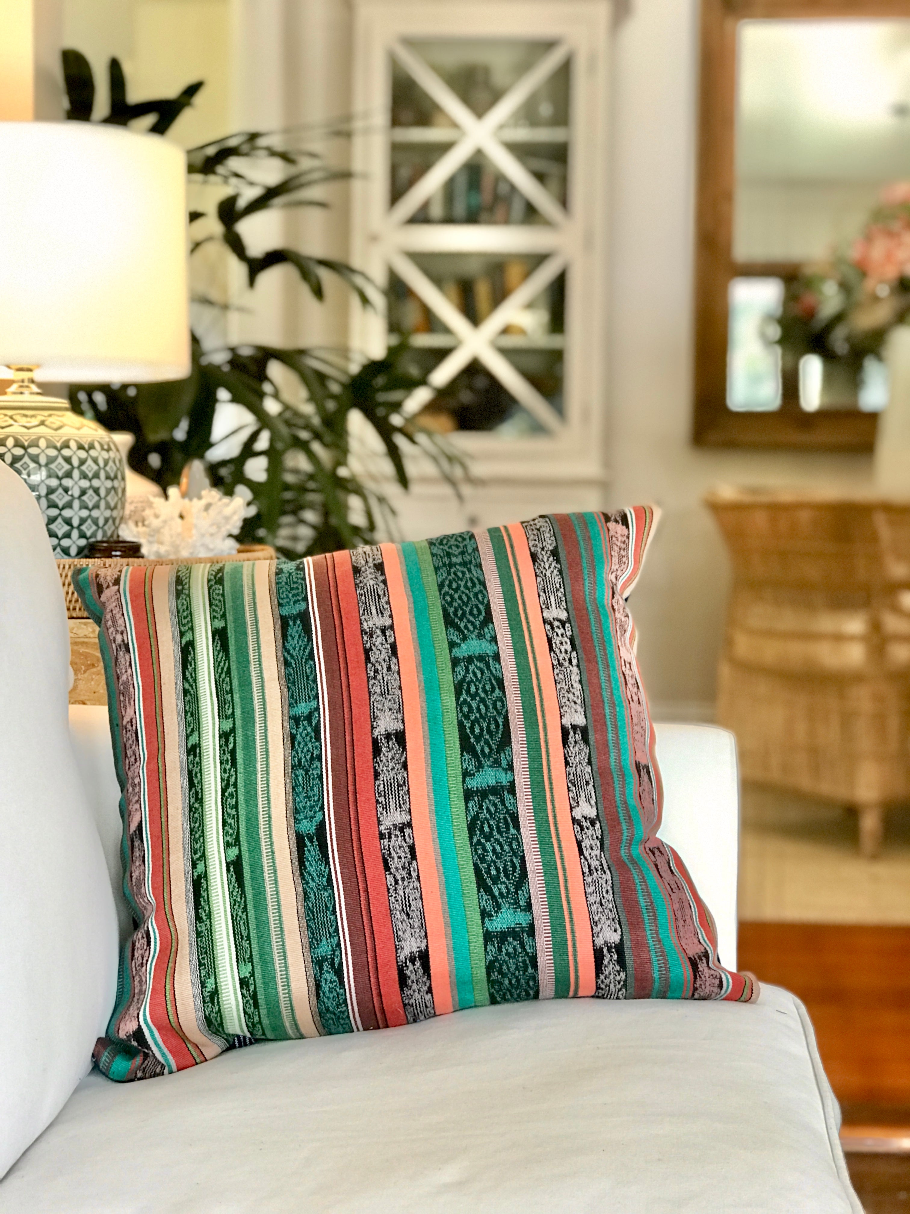 Vintage textile cushion made from a Guatemalan huipil and corte