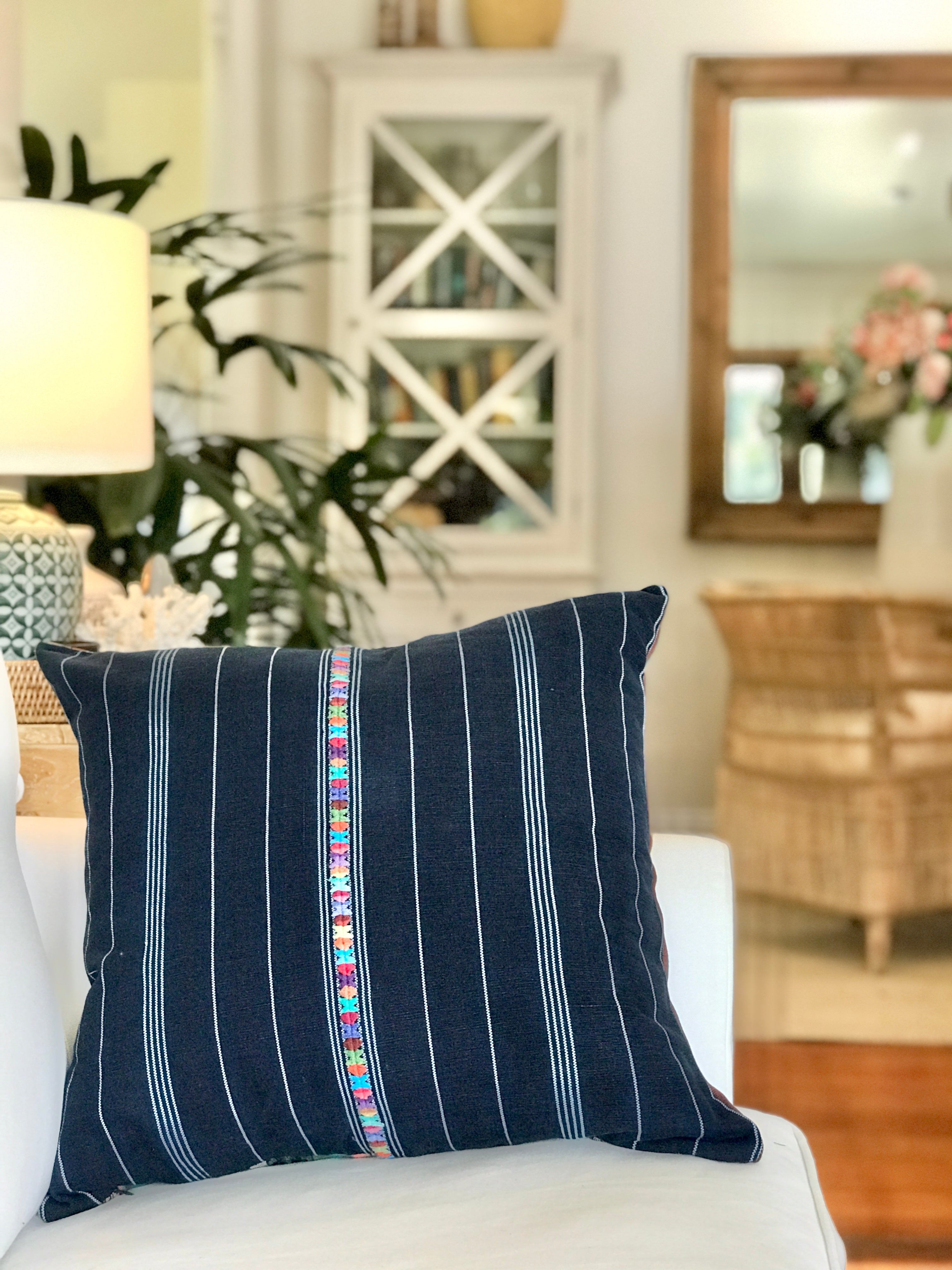 Vintage textile cushion made from a Guatemalan huipil and corte