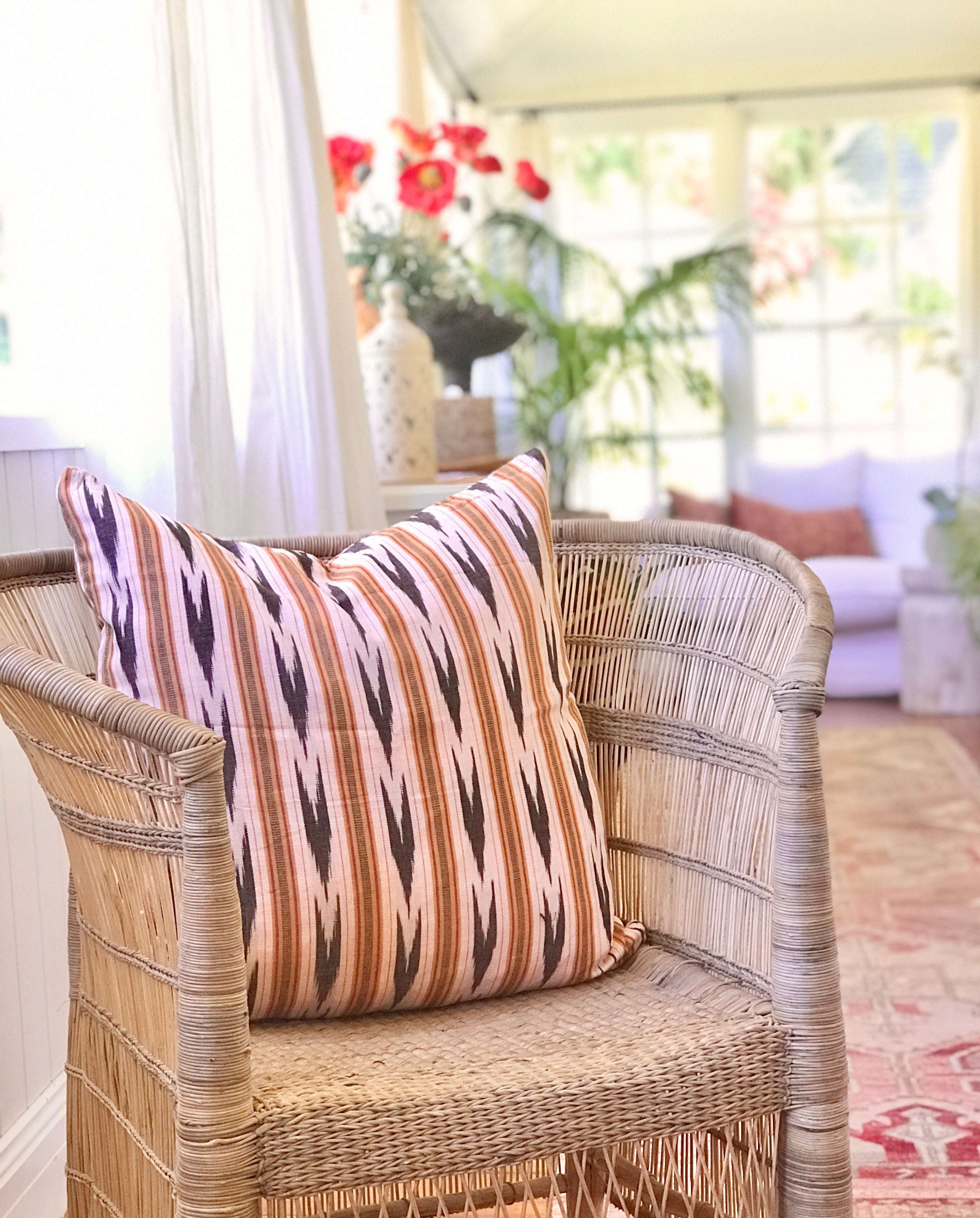 Vintage textile cushion made from a Guatemalan huipil and corte