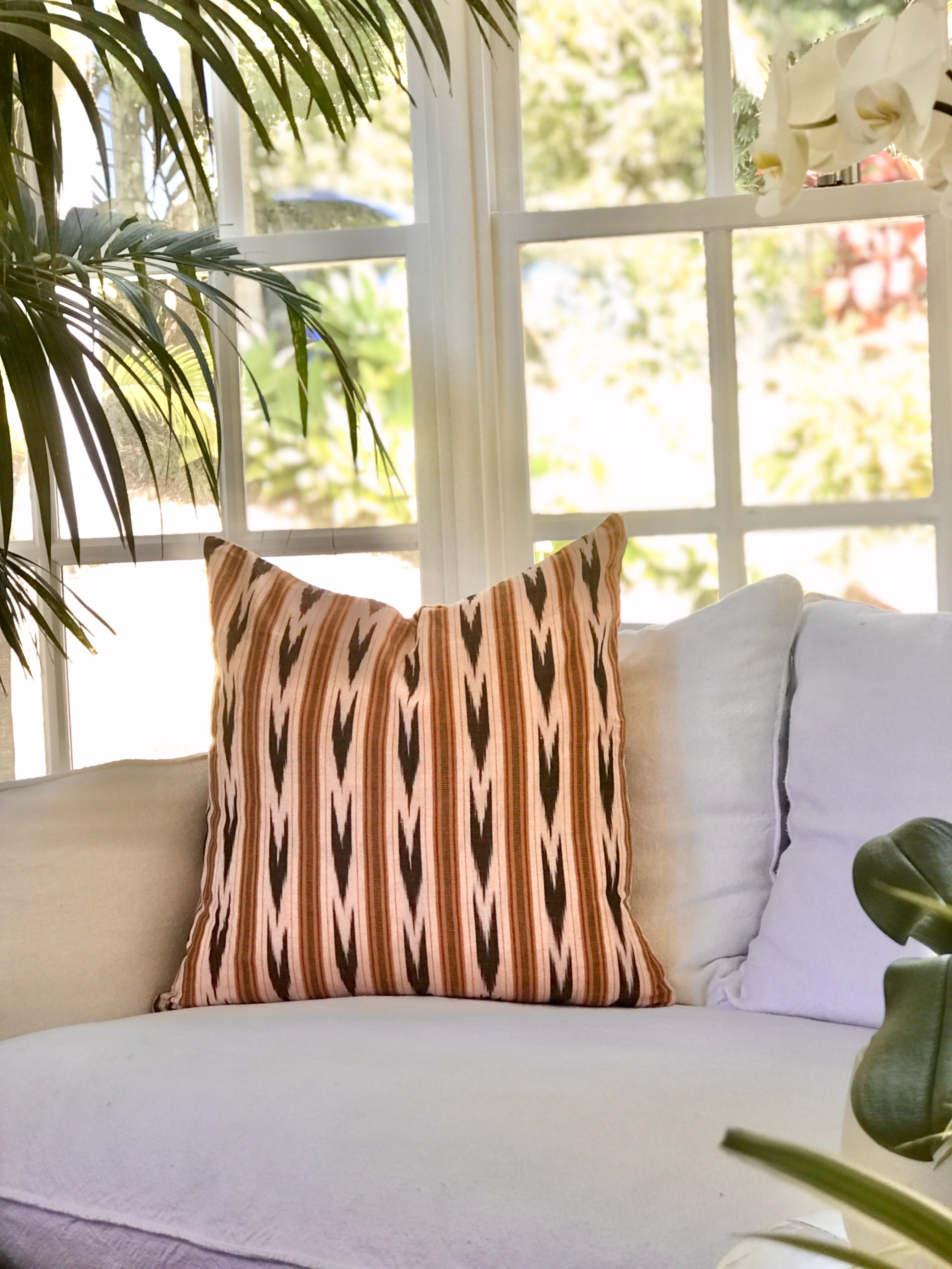 Vintage textile cushion made from a Guatemalan huipil and corte