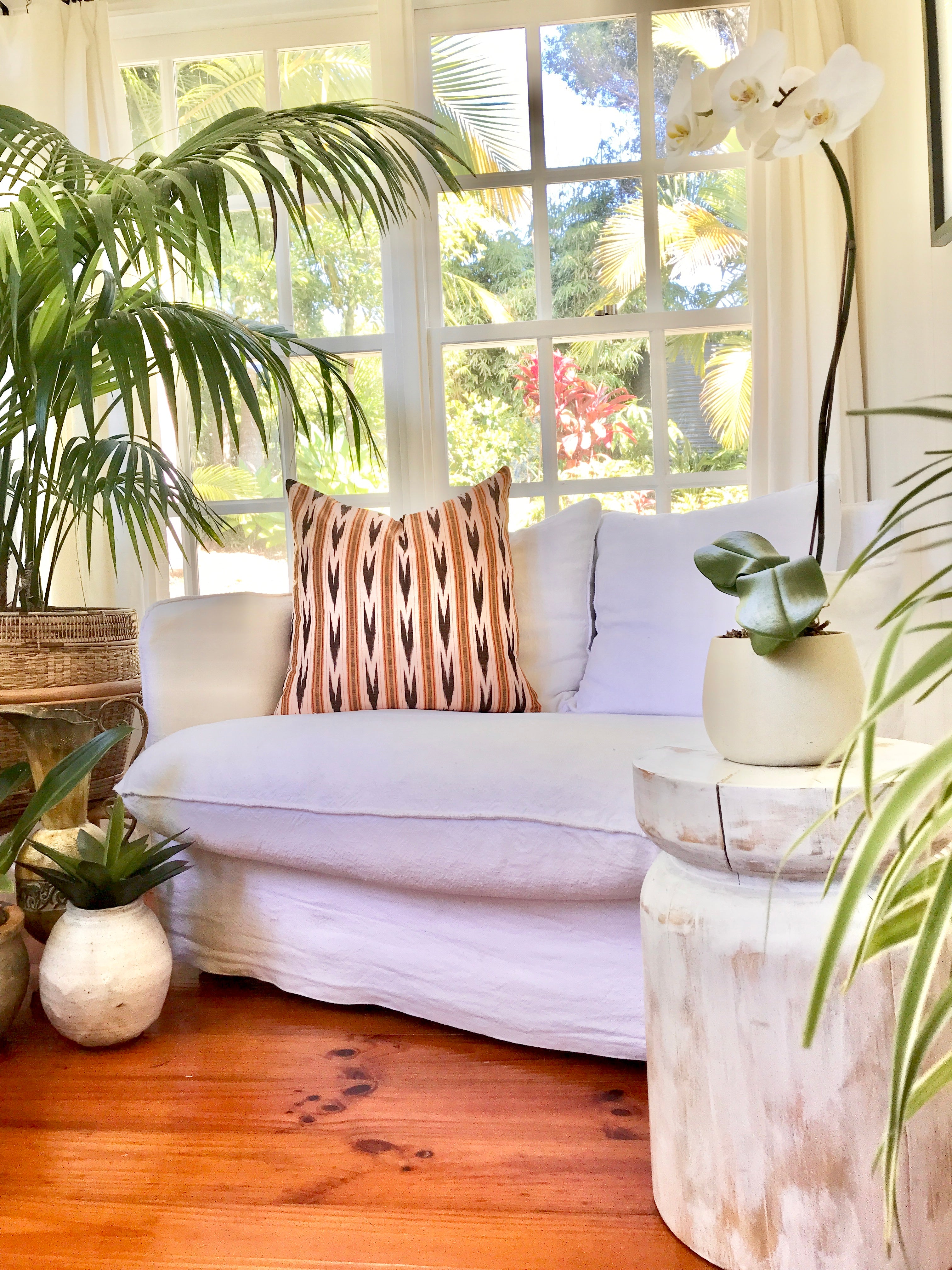 Vintage textile cushion made from a Guatemalan huipil and corte