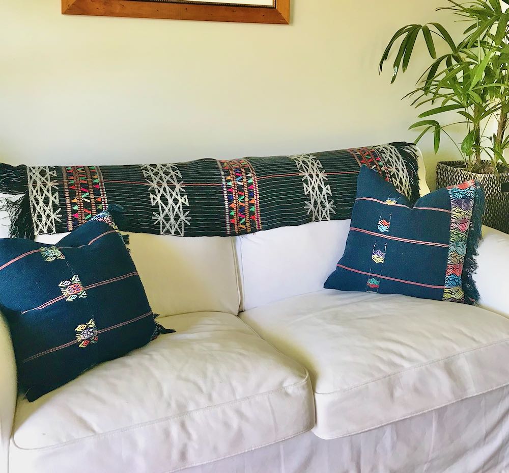 Guatemalan Textile, black with white pinstripe table runner with colourful embroidery and fringe. Originally a San Juan Cotzal tzute