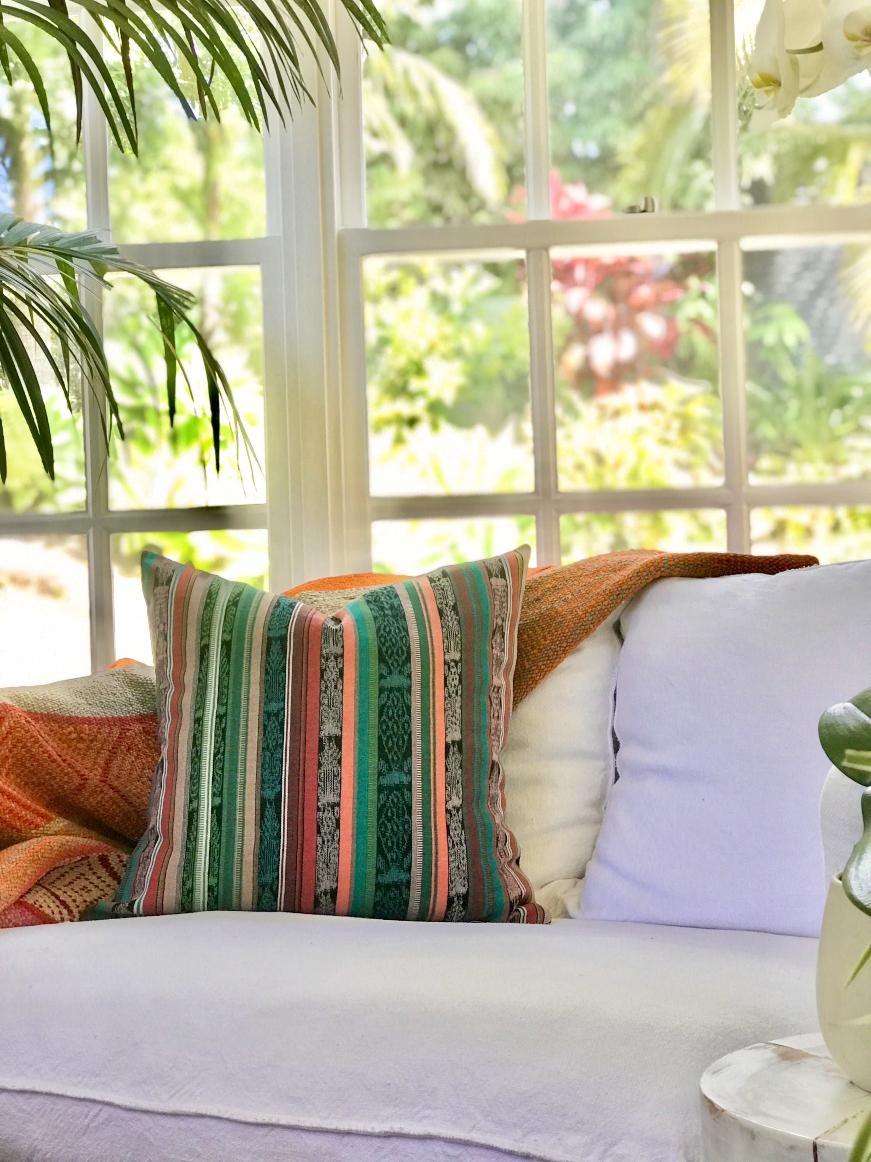 Vintage textile cushion made from a Guatemalan huipil and corte
