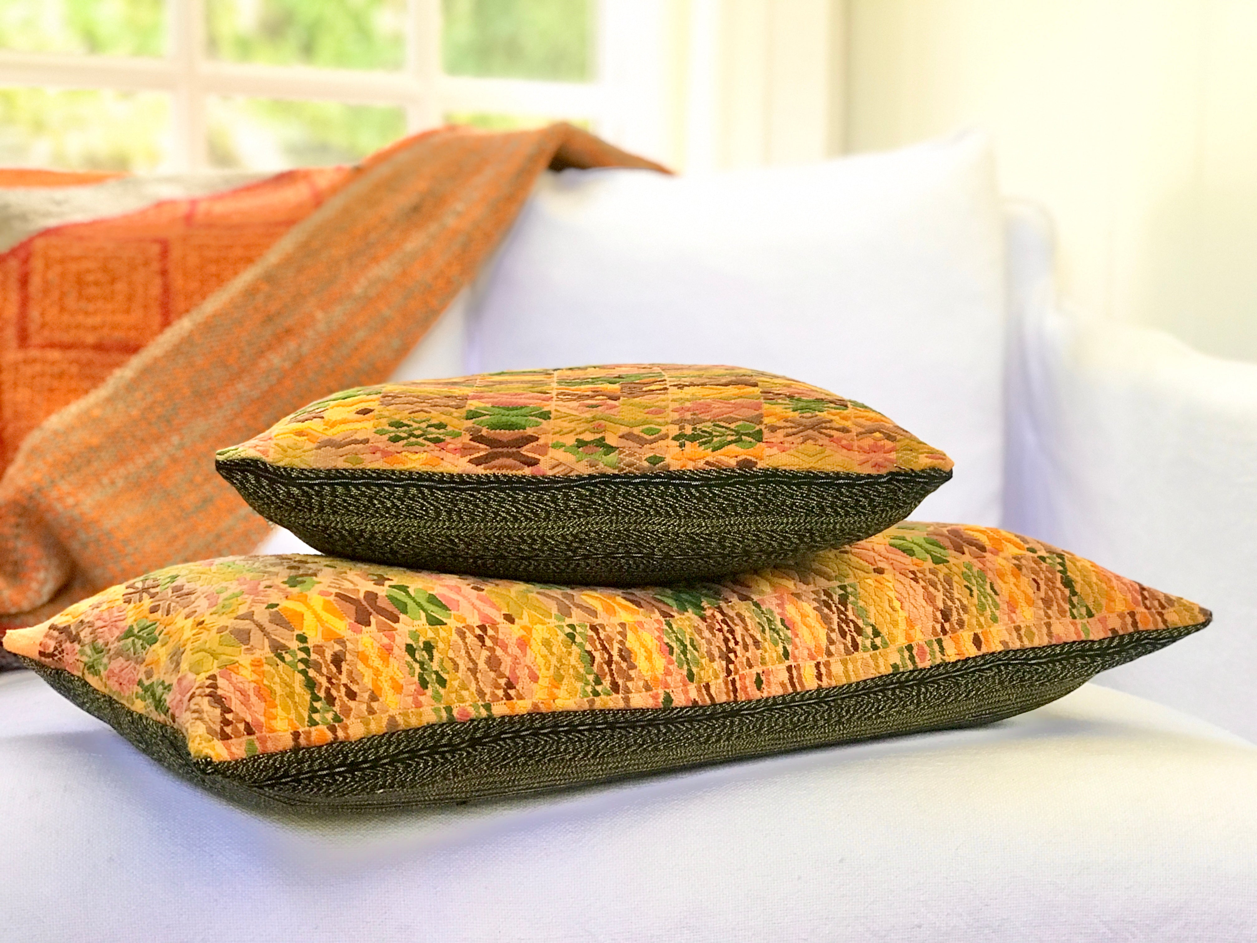 Vintage textile cushions made from a Guatemalan huipil and corte.