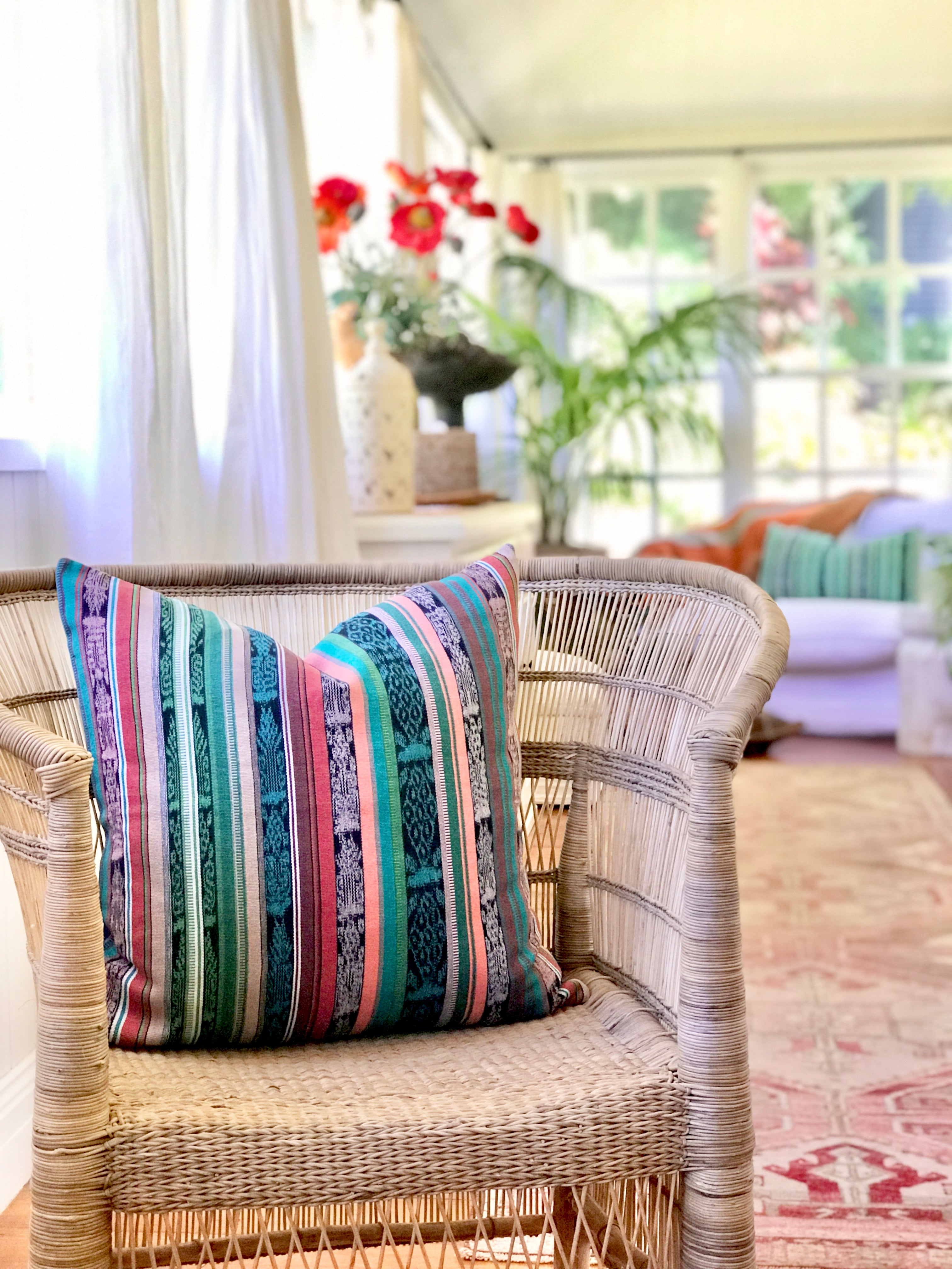 Vintage textile cushion made from a Guatemalan huipil and corte