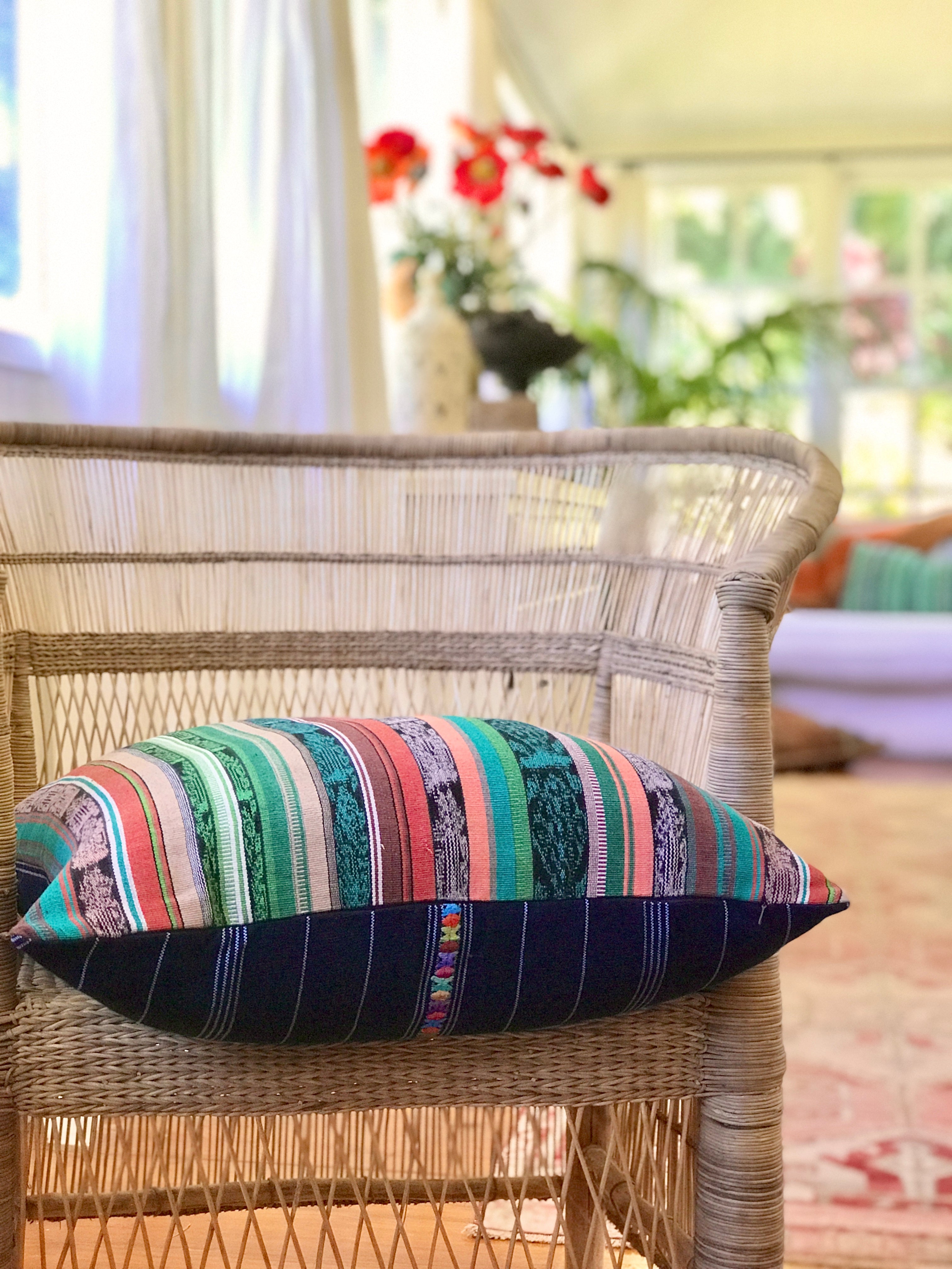 Vintage textile cushion made from a Guatemalan huipil and corte