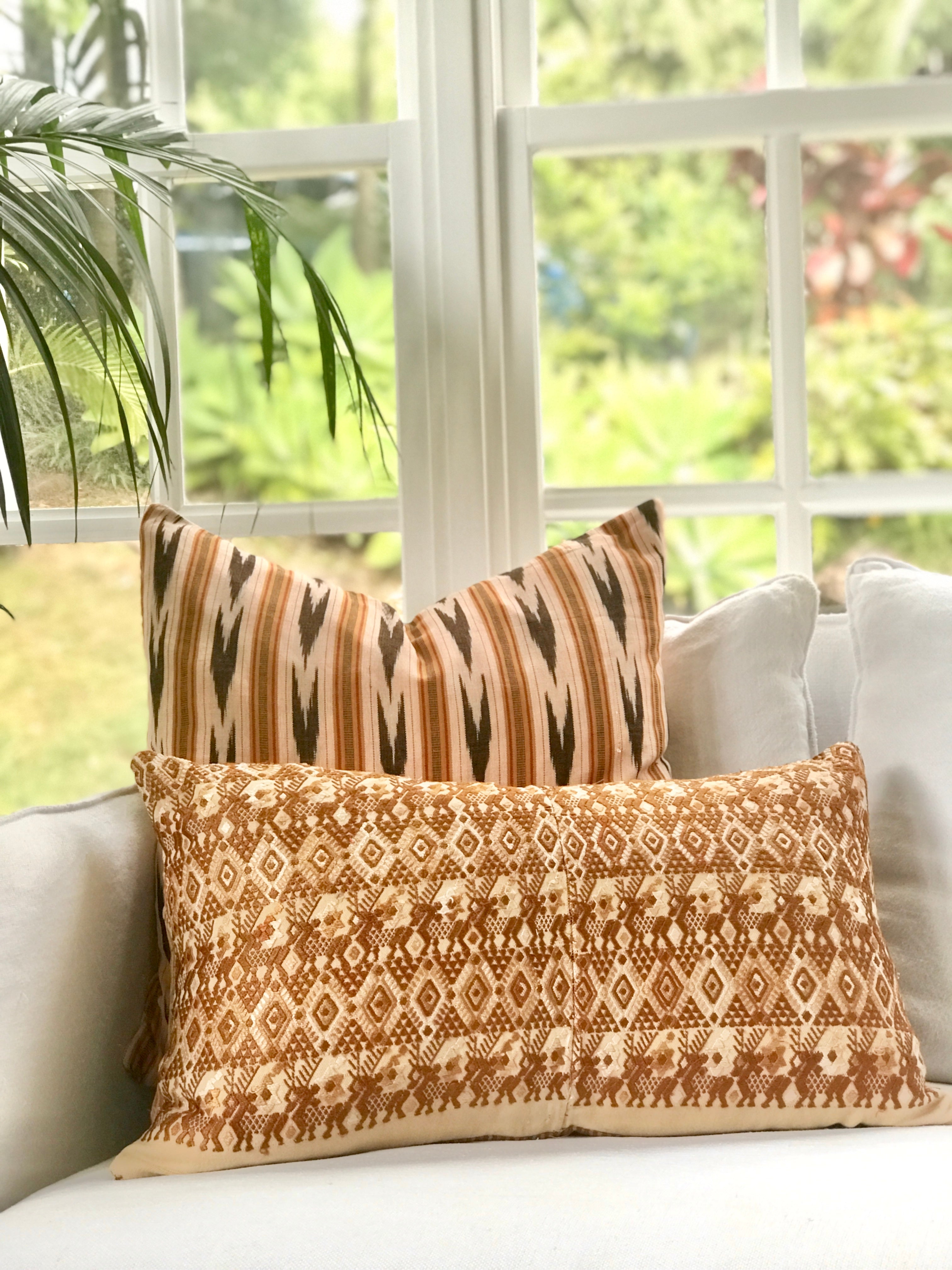 Vintage textile cushions made from a Guatemalan huipil and corte.