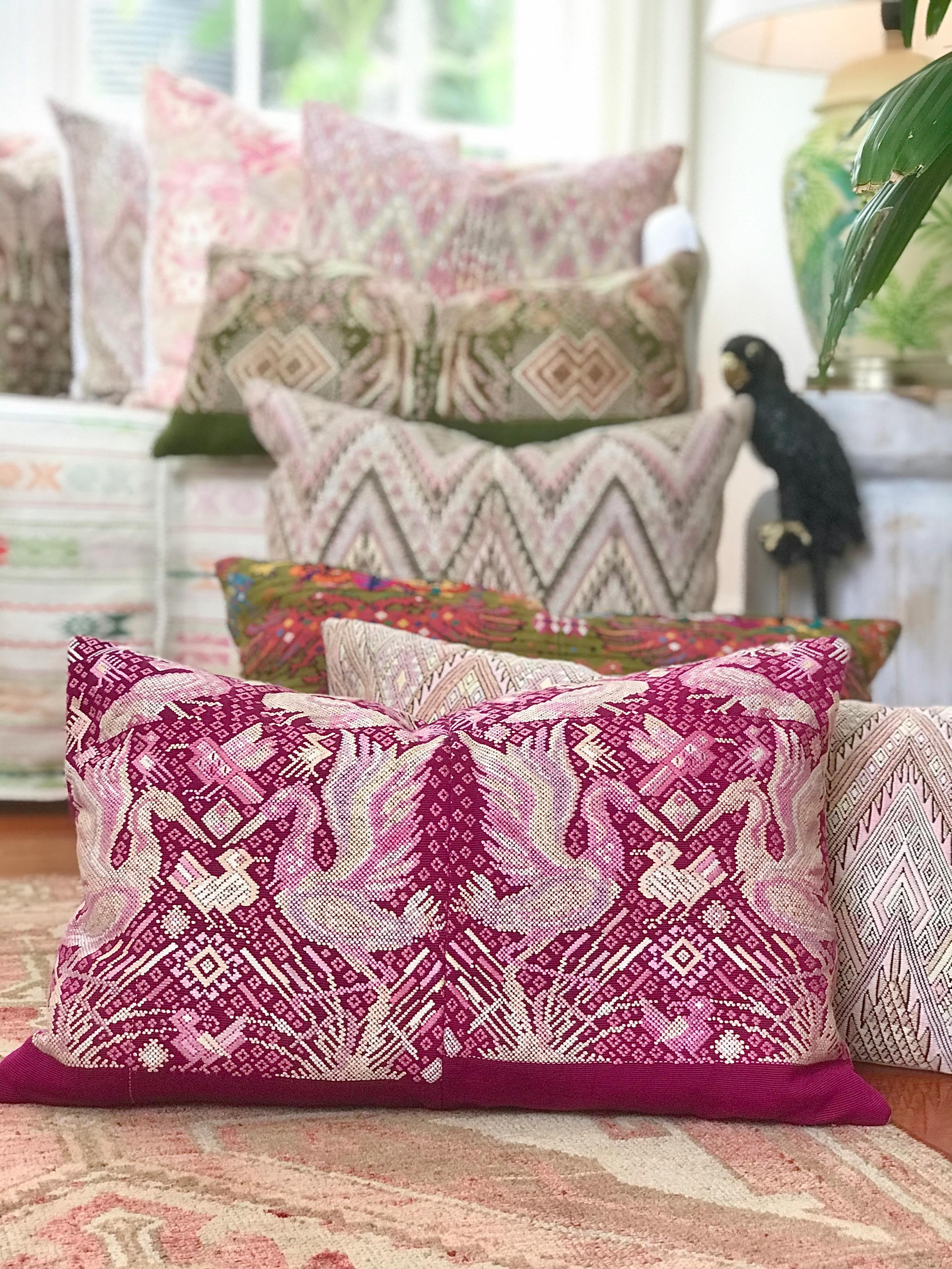 Guatemalan embroidered huipil pillow. Chinoiserie style of Ibis birds in bold fuchsia and white