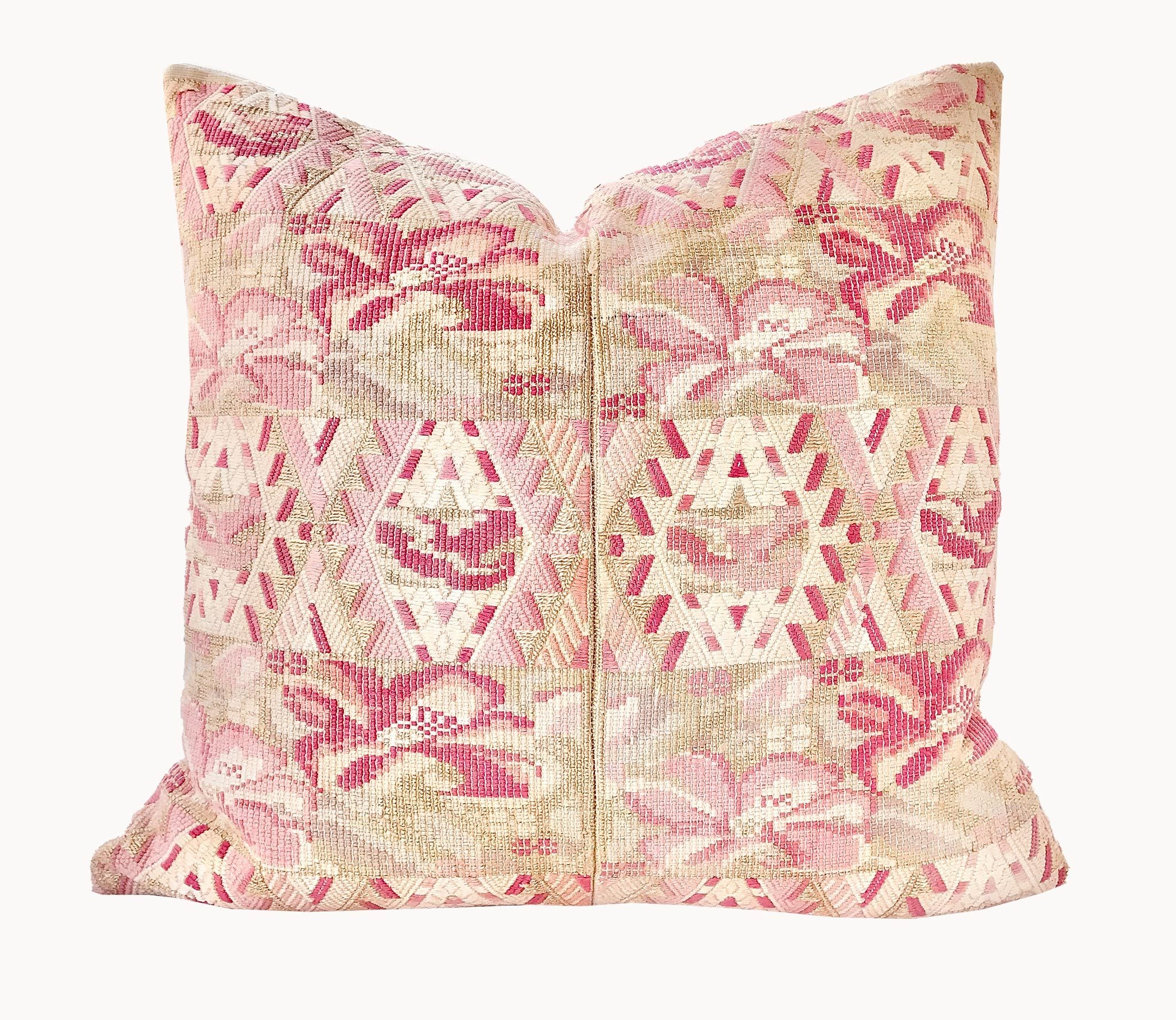 Guatemalan embroidered huipil pillow. Abstract flowers in a pale pink and white palette.