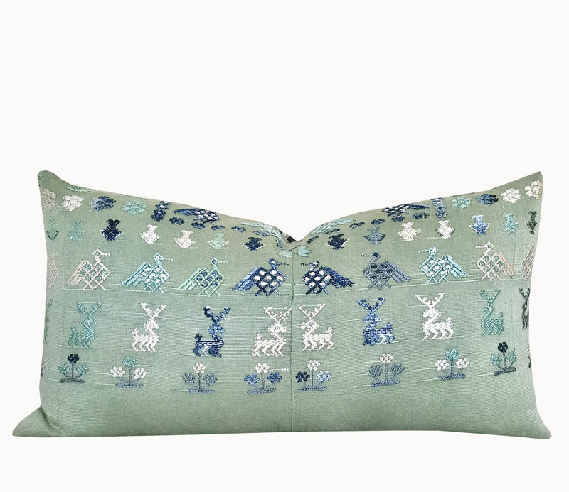 Vintage textile cushion made from a Guatemalan huipil and corte