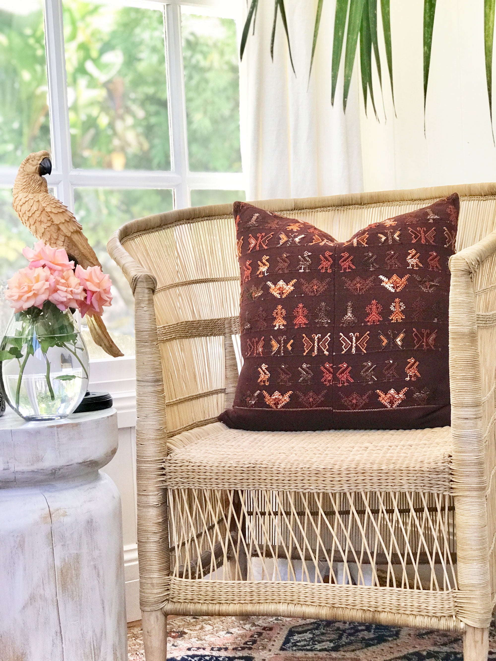 Brown Guatemalan embroidered huipil pillow.