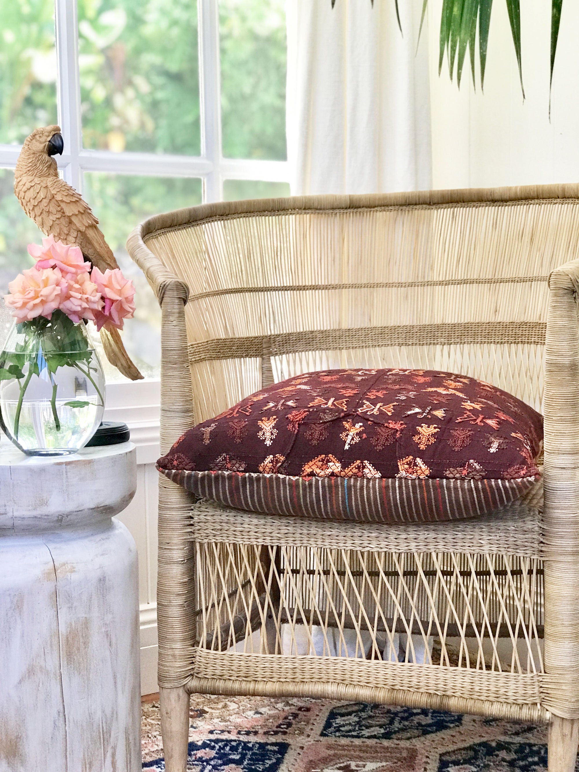 Brown Guatemalan embroidered huipil pillow.