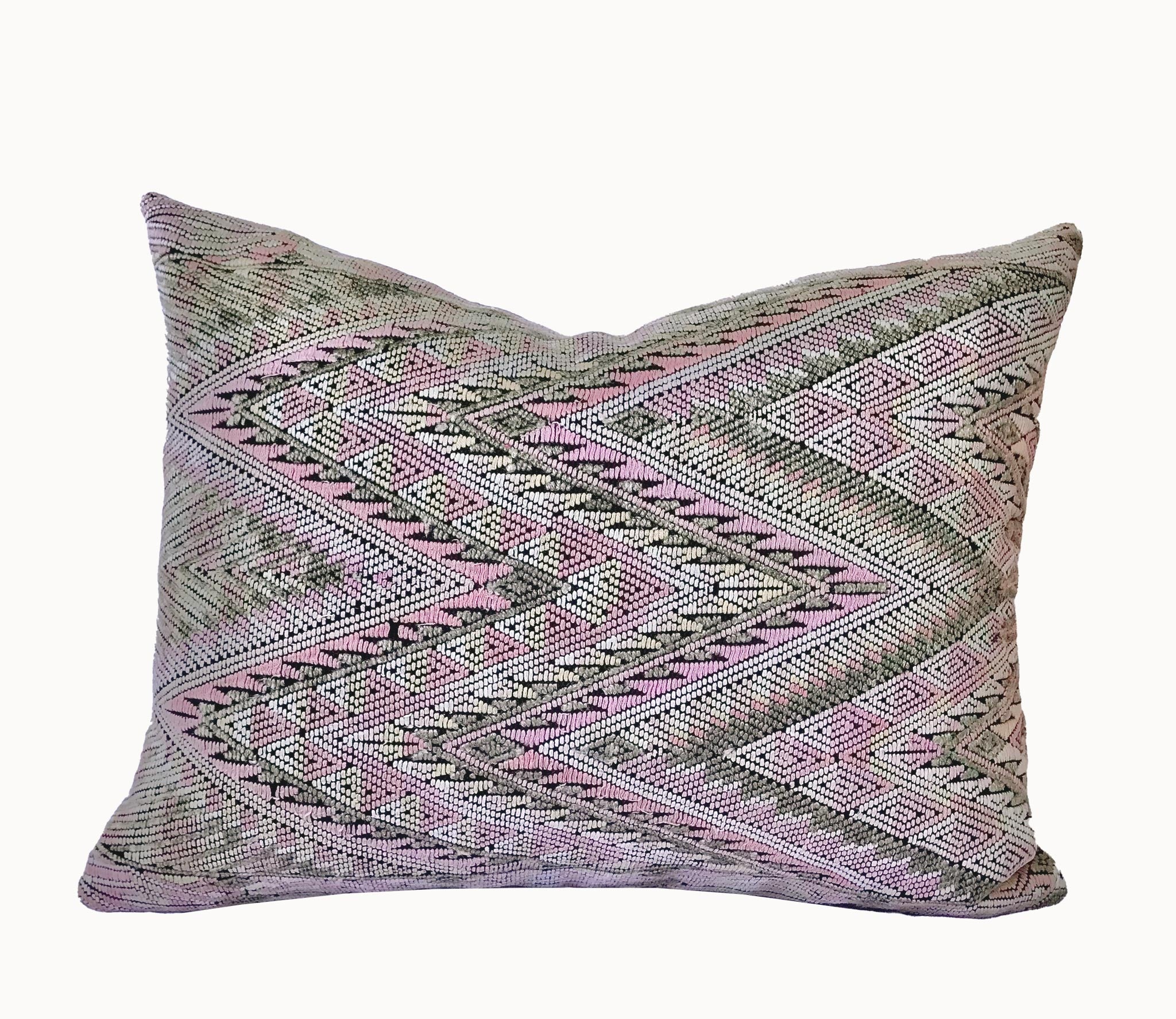 Guatemalan embroidered huipil pillow. Geometric chevron pattern in a pale pink palette.